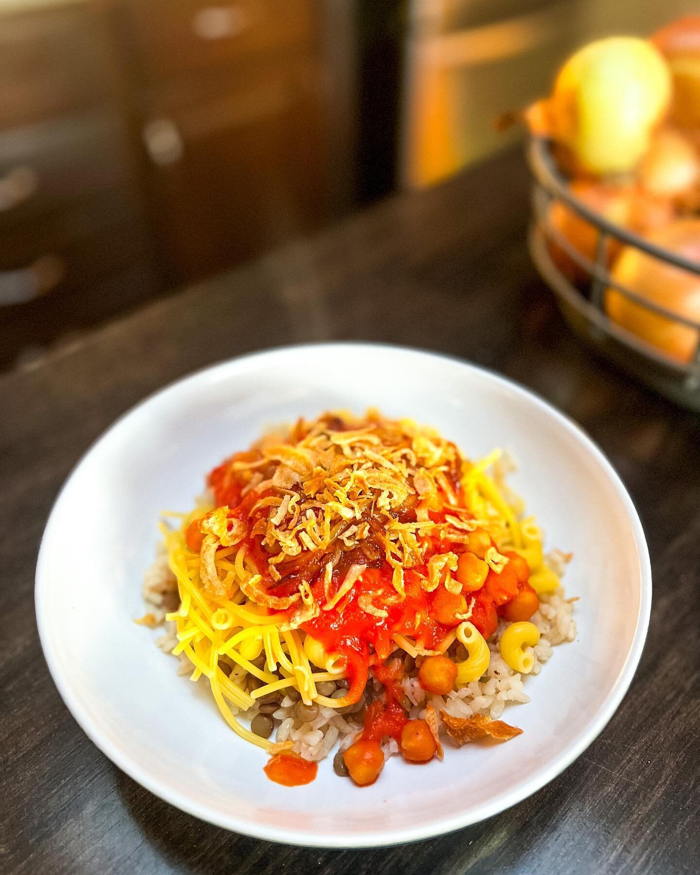 Koshari - or rather, my gluten free attempt. 

The national dish of Egypt, this carb loaded, vegan meal is delicious, a little tangy and spicy, and an absolute delight. 

Rice, pasta and lentils, along with chickpeas in a spicy tomato sauce, topped w