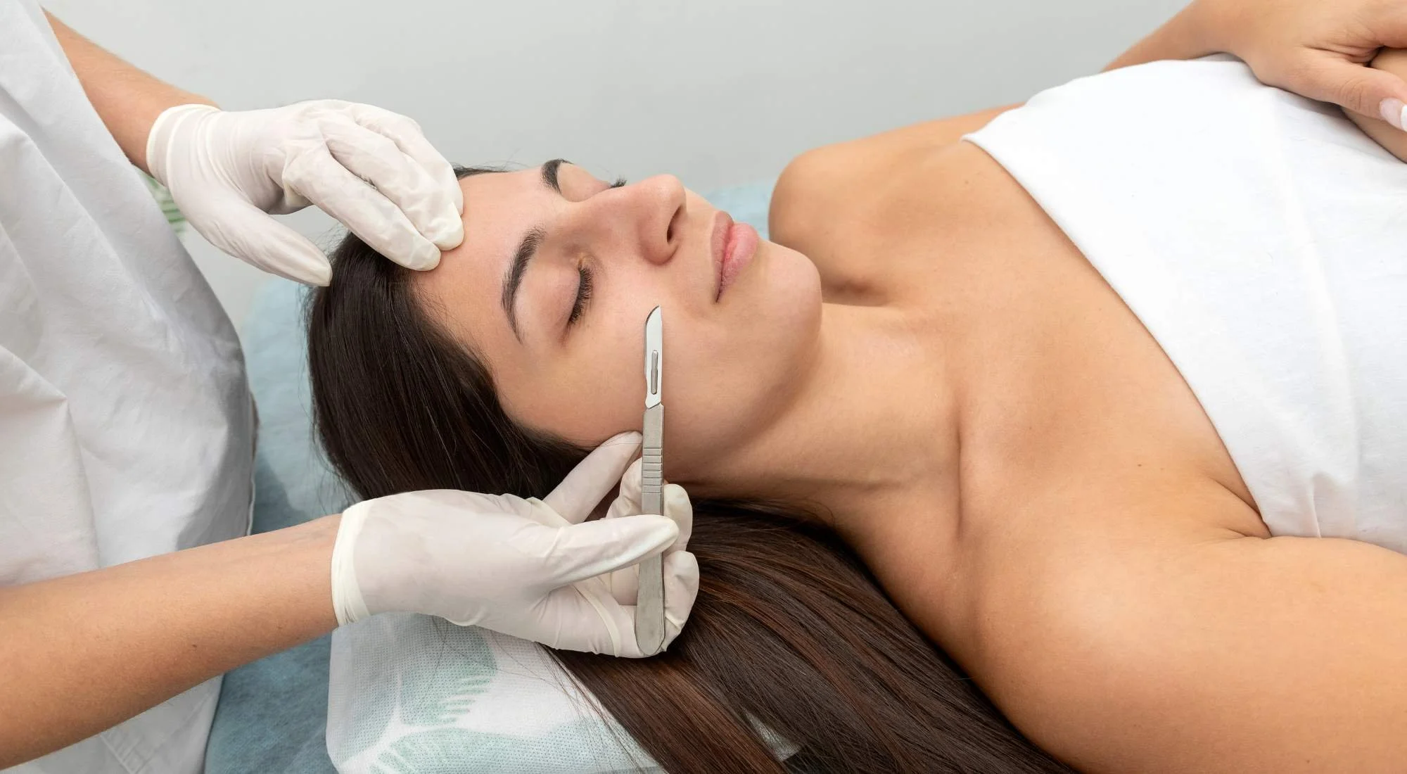 A woman receives a dermaplaning treatment in Bend, OR.