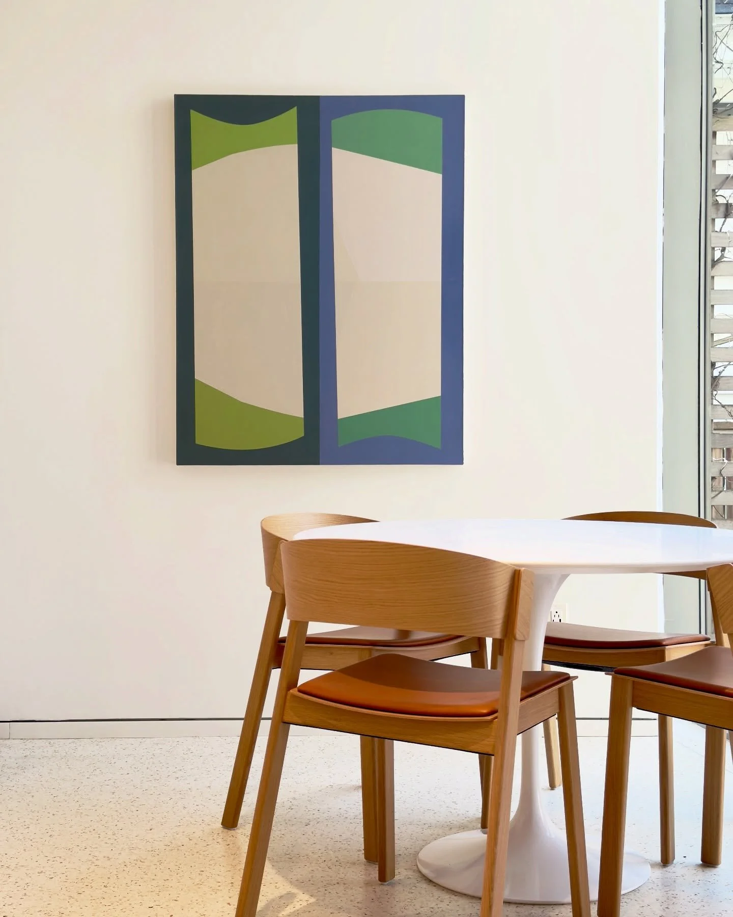 This work by Larissa Tiggelers has found a home at the office of one of our private clients. On display in their light-filled kitchenette, the work plays off the forms of the window and creates an illusion of depth through the artist&rsquo;s use of c