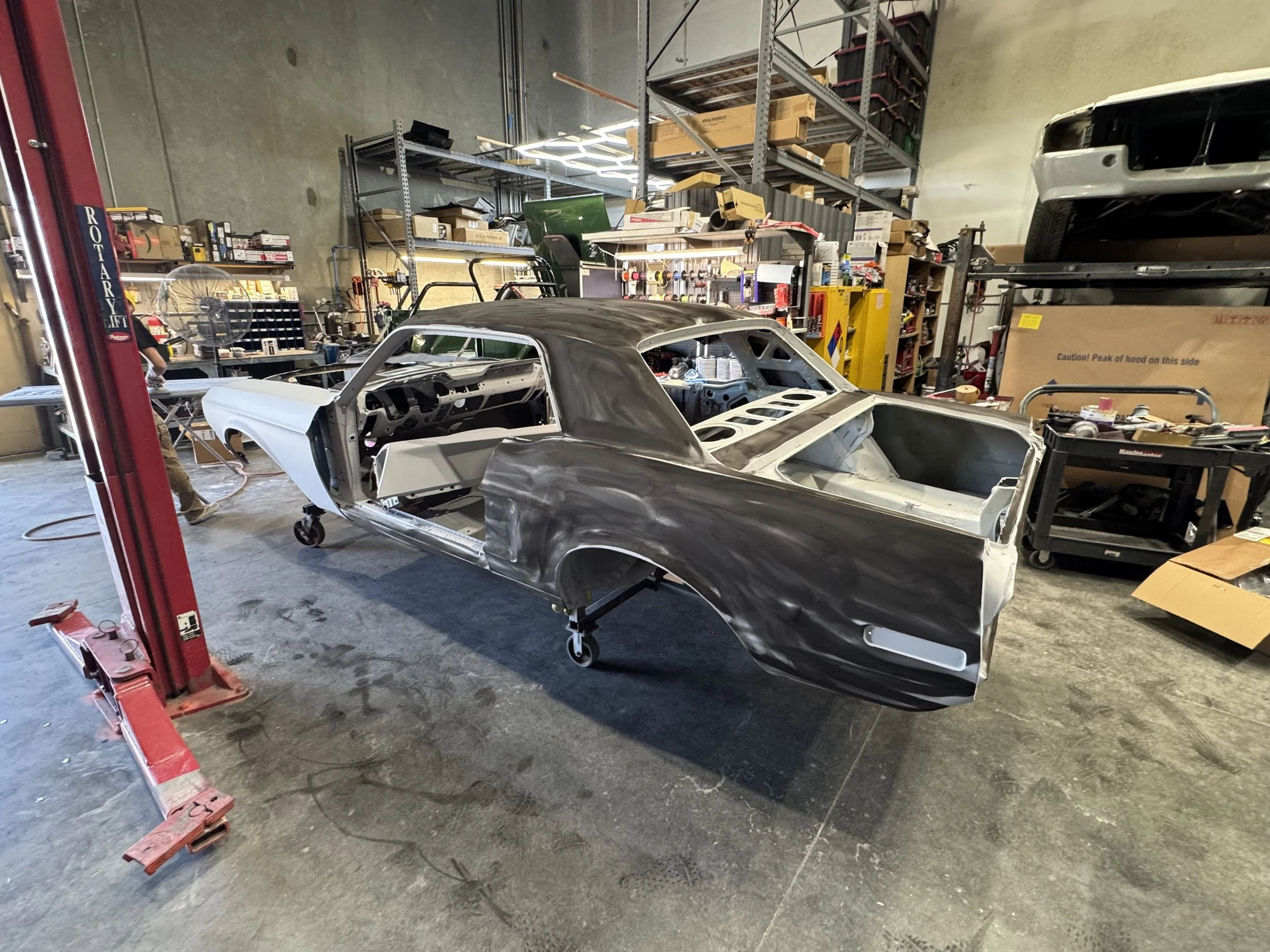 Final stage of blocking, we lay it on with great coverage and begins with 220, 320 and 400.  We seal our body work, and then add 3 more layers of primer for final blocking.  That allows us to make sure were straight as possible for the show car finis