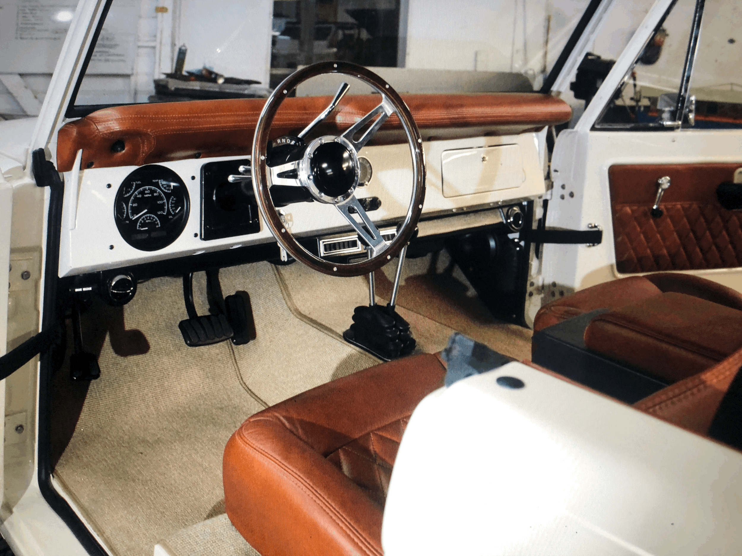 Custom Leather Interior, Custom Carpet, Dakota Digital Gauges, Ididit Column, 15" Lecarra Wood Wheel, Lokar Pedals, Kenwood Blue Tooth Stereo custom kick panels with 5.5" speakers & rear 5x7 box