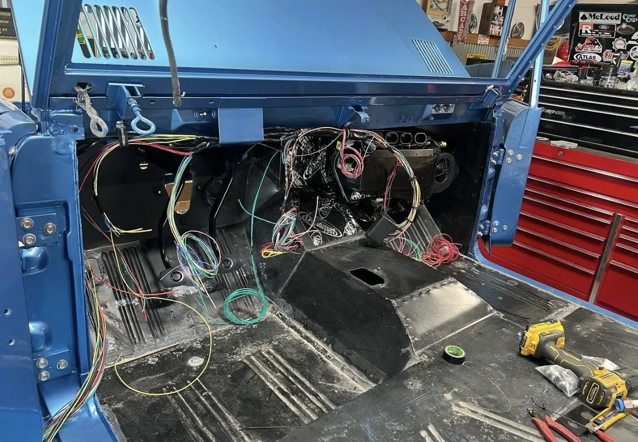 Once we have mapped out our harness, we do a dry run, making sure lengths are there, and any extras are all in place.  After this we wrap our harnesses and add a braided wiring sleeve