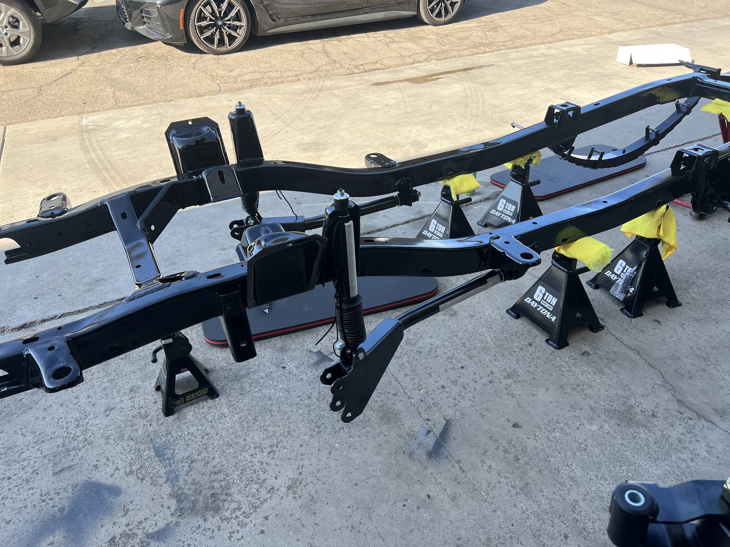 Chassis back from powder coating, and installing our Duff Suspension so she can be a roller again for assembly.