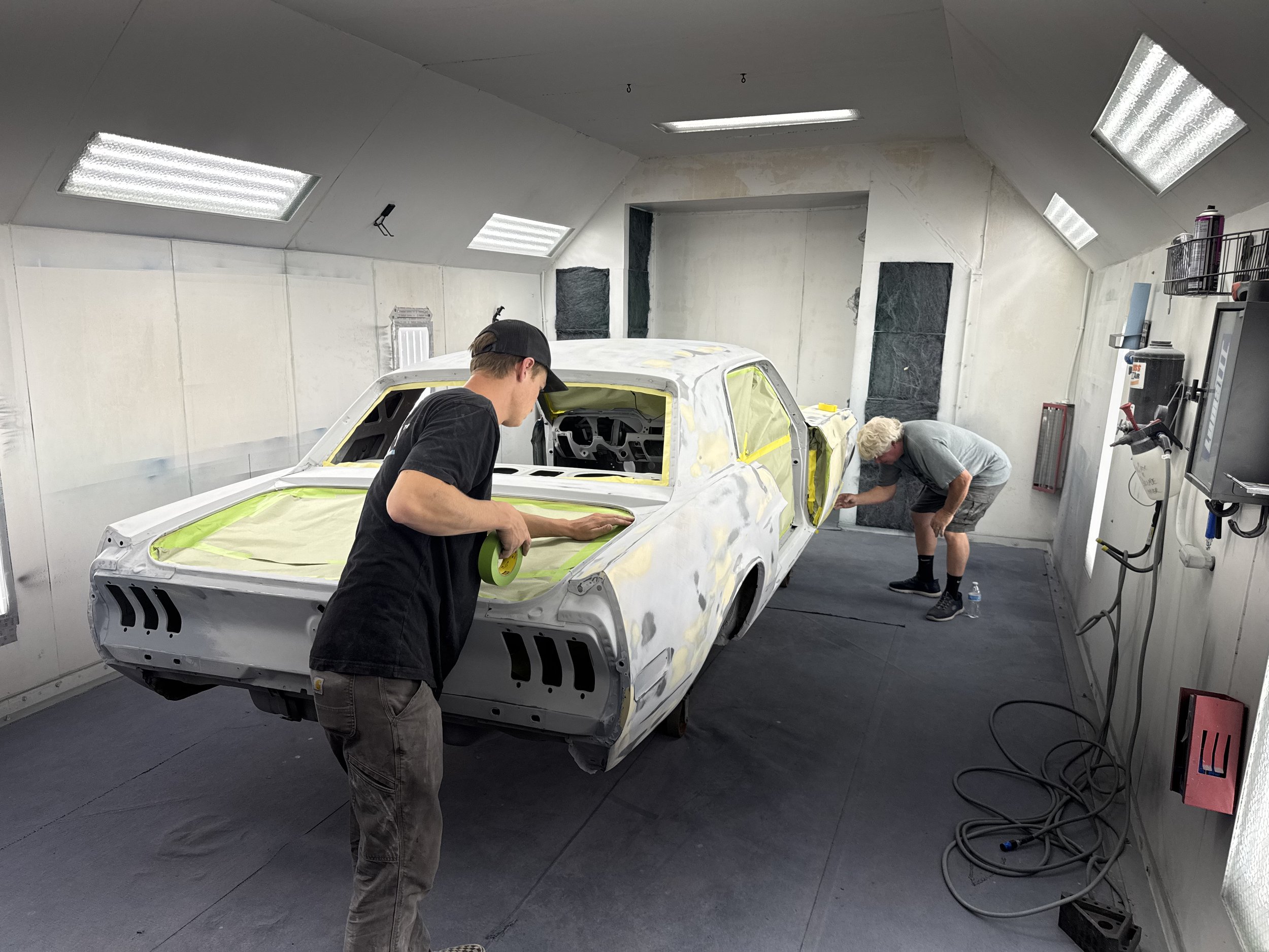 We do as much metal work as possible with little filler used, here were prepping the sherifs 68 QC car for more Optix primer for blocking.  We shoot 3-5 layers of Optix primer and block from 80 all the way up to 400 by hand.  