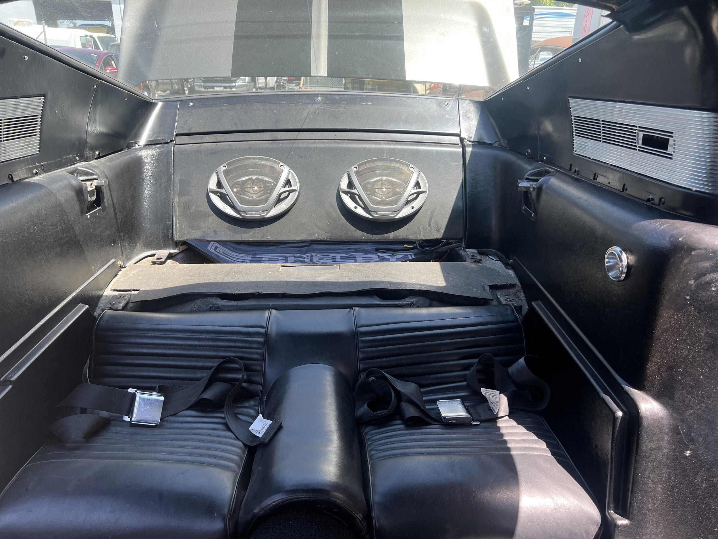 Rear seats going in with the factory panels 