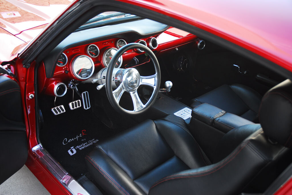 Custom one of a kind fiberglass dash, ProCar Seats recovered in leather with red twin stitching, Stewart Warner Gauges, Ididit Column, Vintage Air AC, Lokar Pedals. Custom Interior.