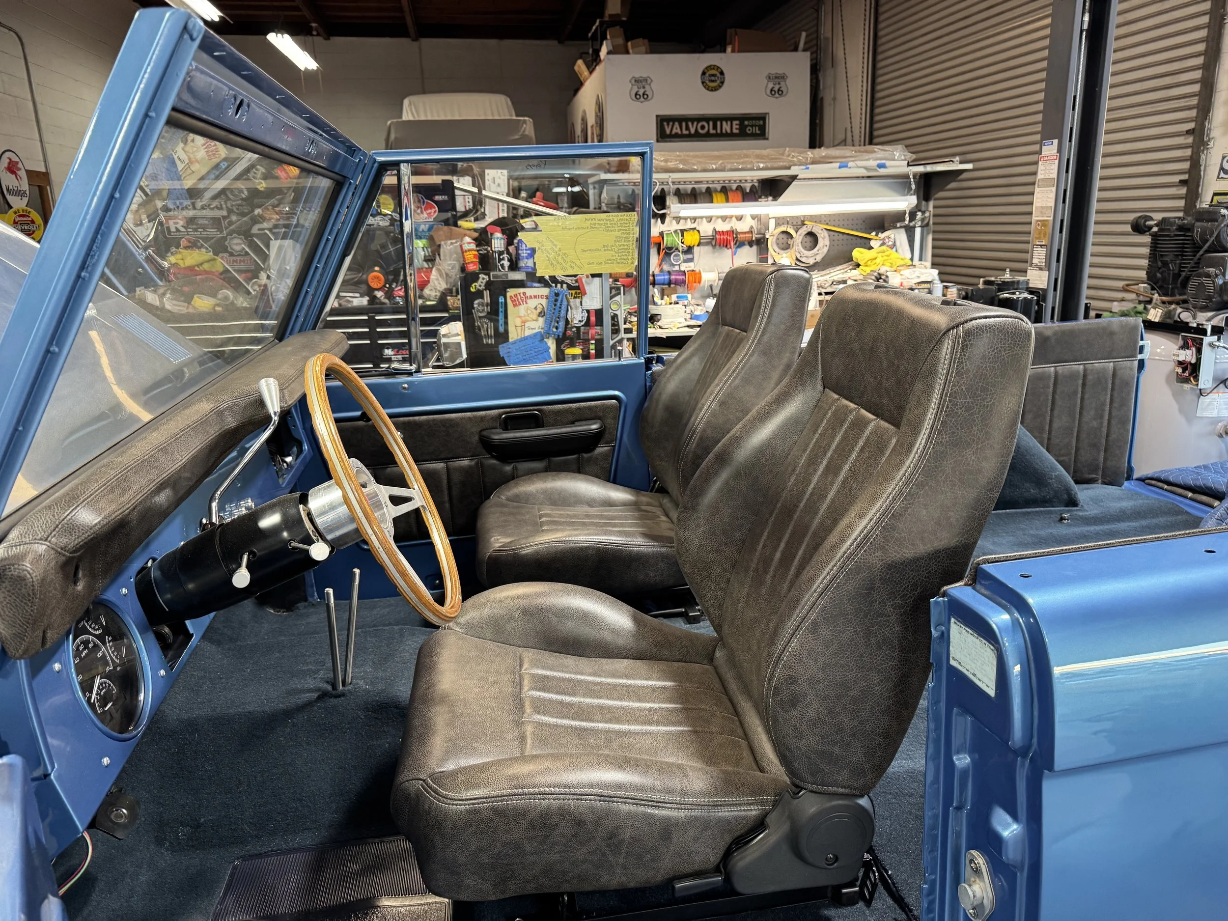 Front carpet all in, front bucket seats are in, and so is the dash.  Interior is finally starting to show what she's gonna be with that blue 