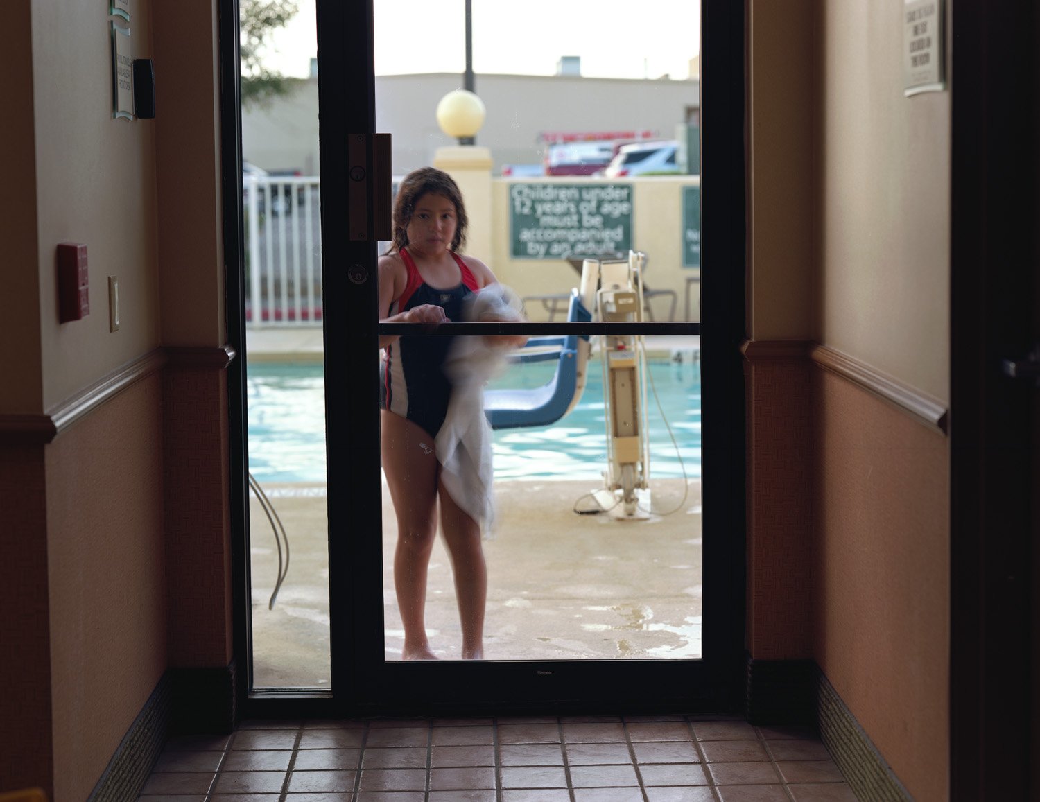 Girl at pool in La Quinta Inn, El Paso, Texas
