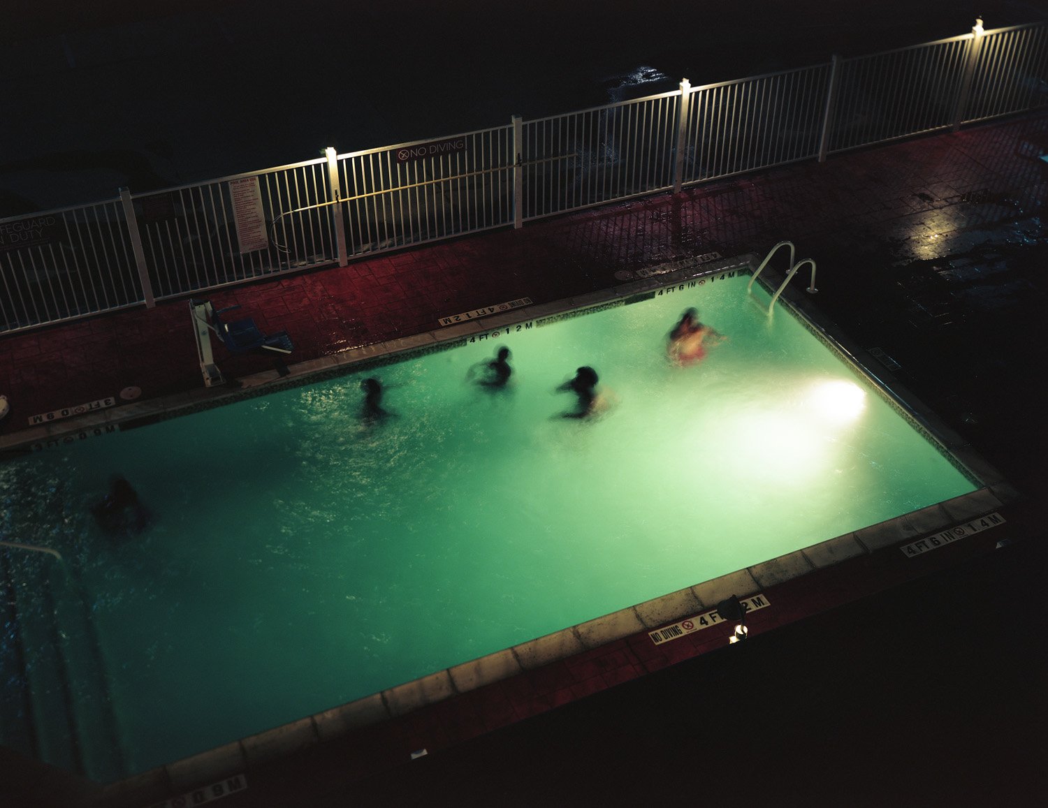 Teenagers playing in pool, Houston, Texas