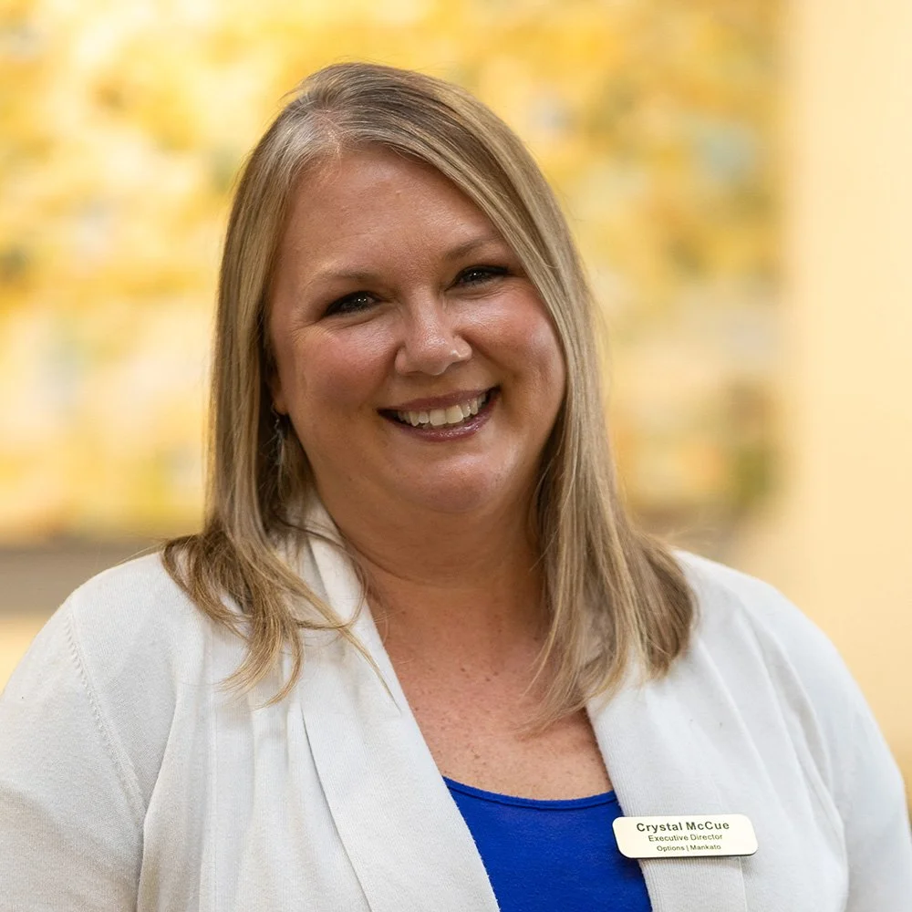 A portrait of Crystal McCue, Executive Director at Options Mankato.