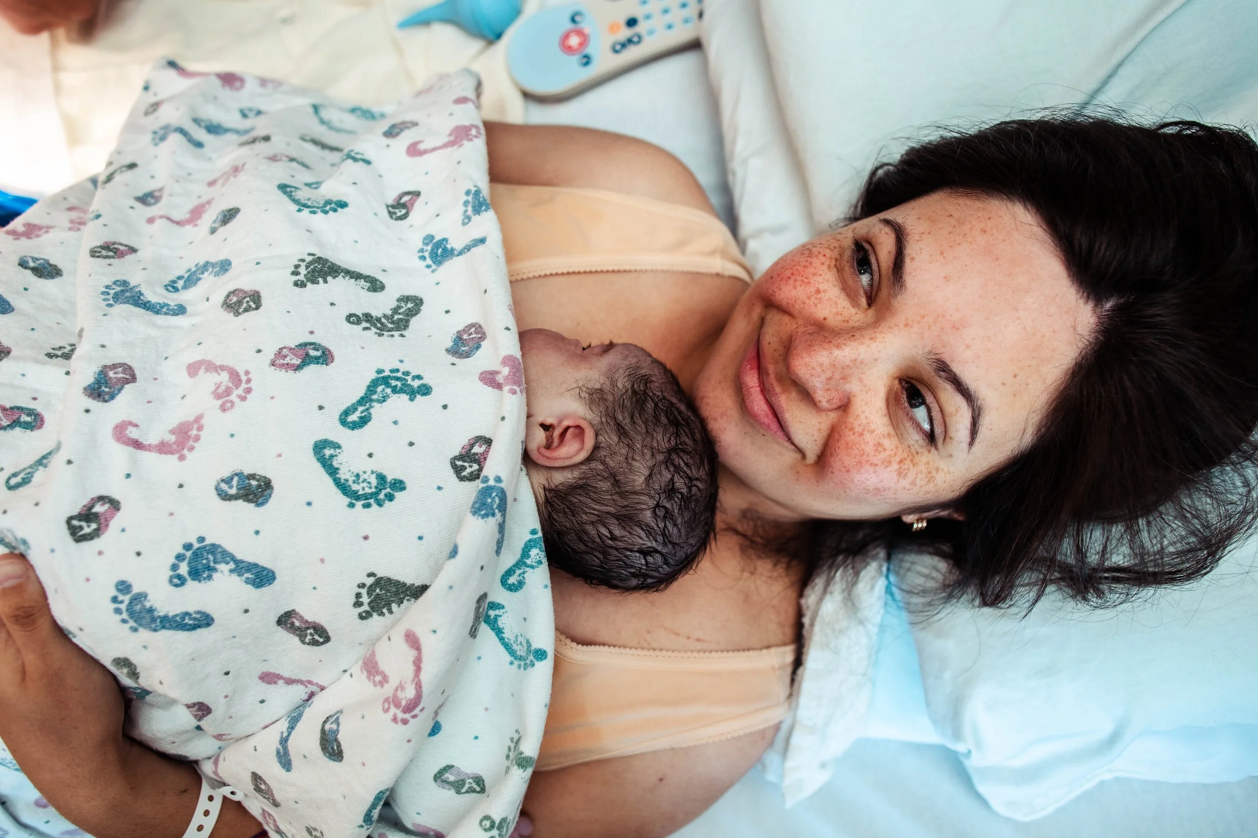 Baby skin to skin with mom after a beautiful VBAC delivery in hospital
