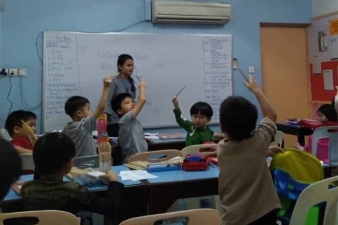 Primary 1 students excited to answer questions (Copy)
