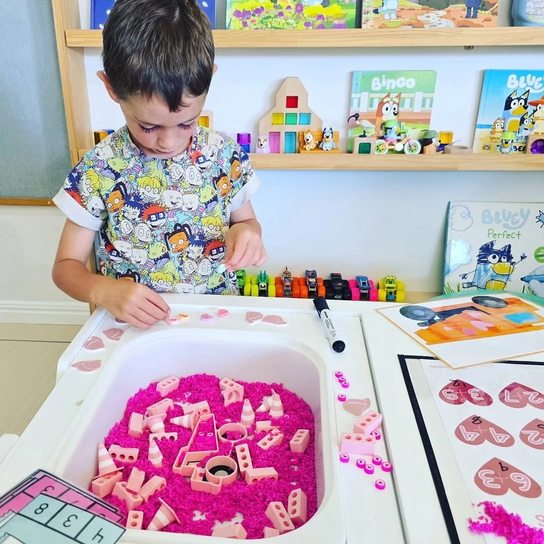 pink Dump truck play tray for construction sensory play