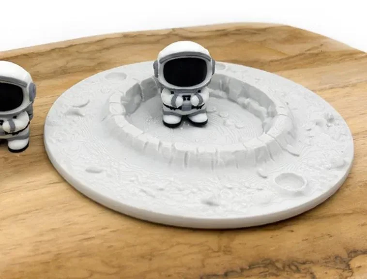 Moon Crater Sensory Tray for children's sensory play with realistic lunar surface and crater details.