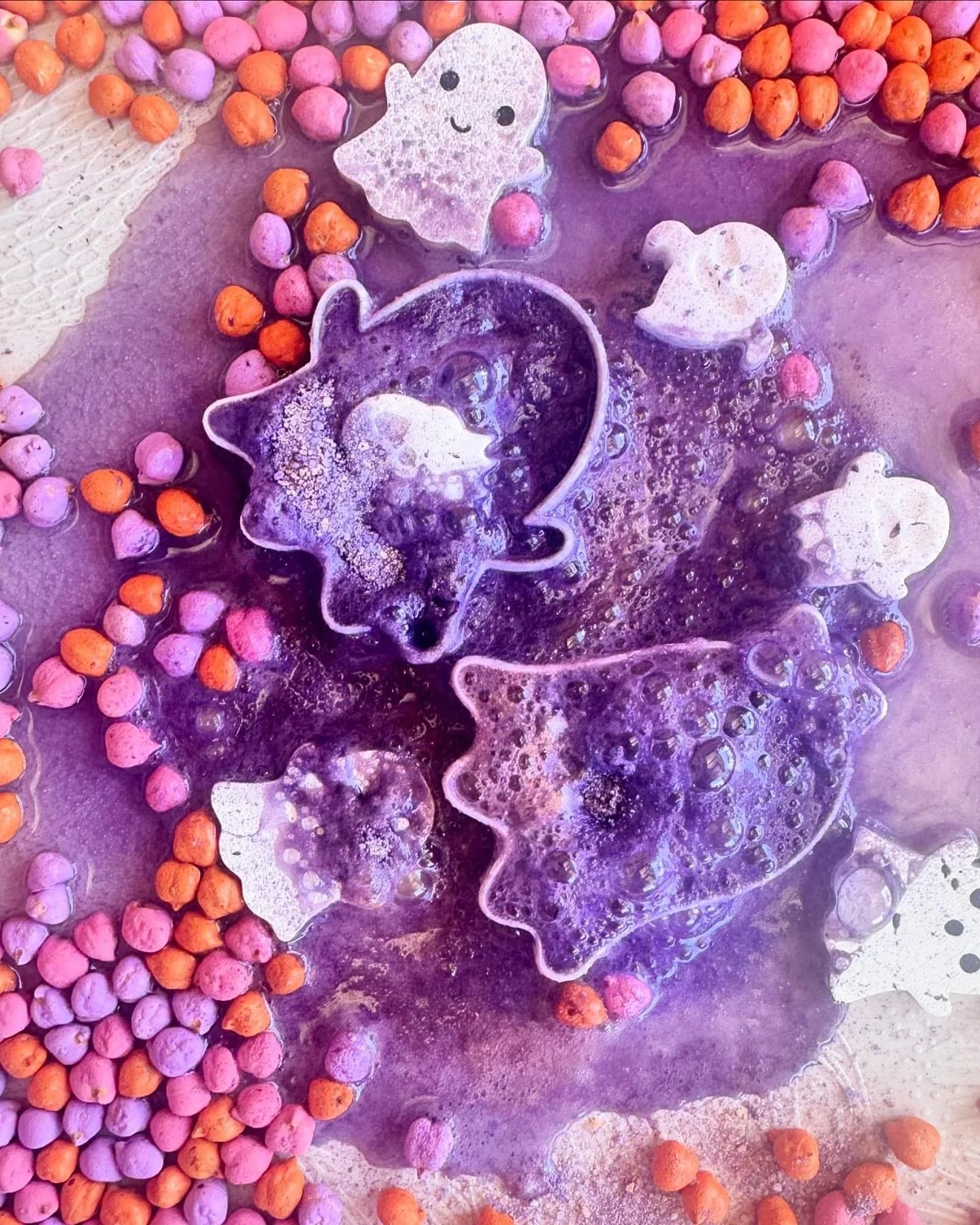 Halloween potion play activity featuring fizz, cauldrons, pumpkins and magical sensory ingredients
