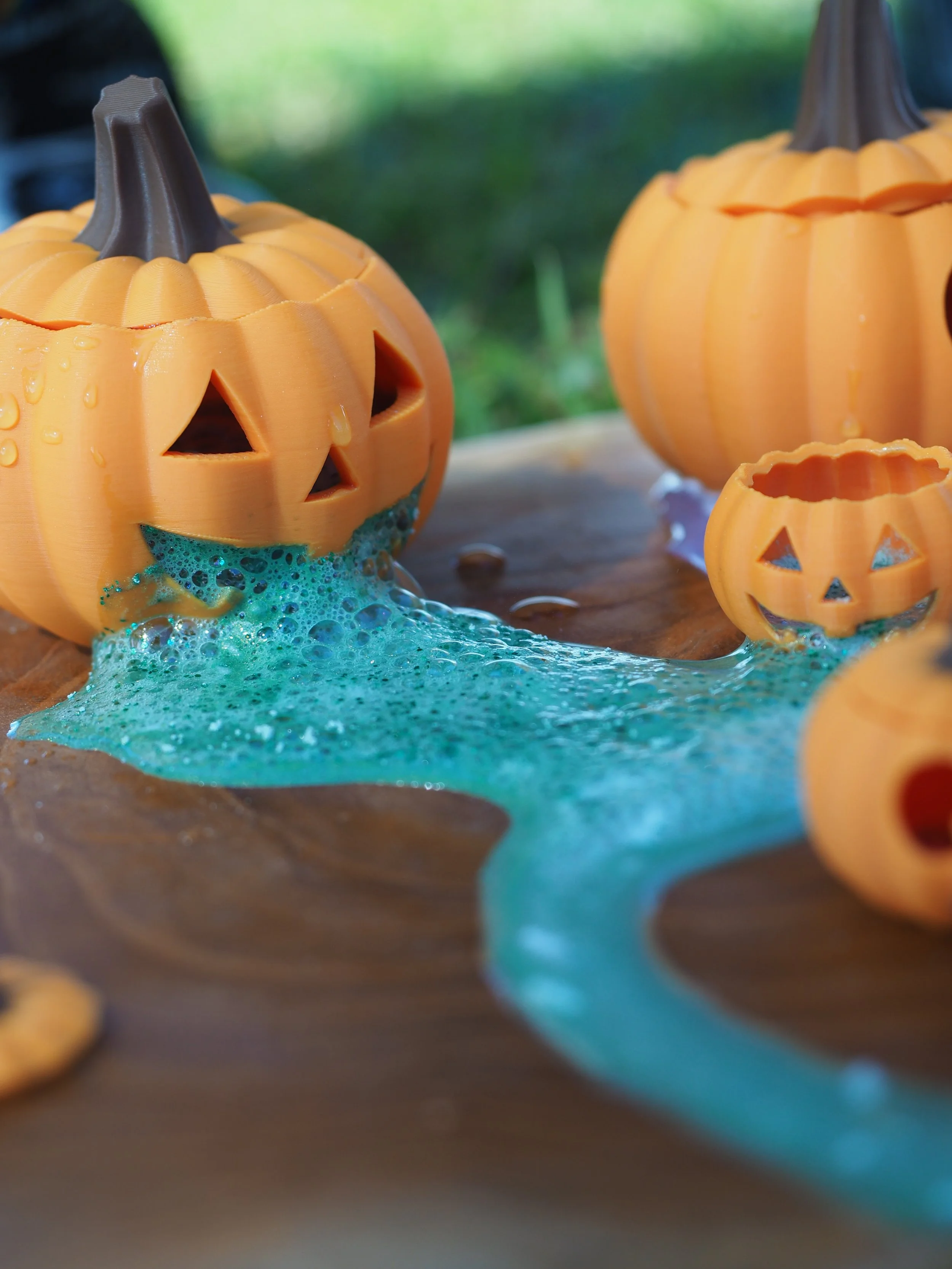 Children exploring Halloween-themed potion play with spooky loose parts and sensory materials