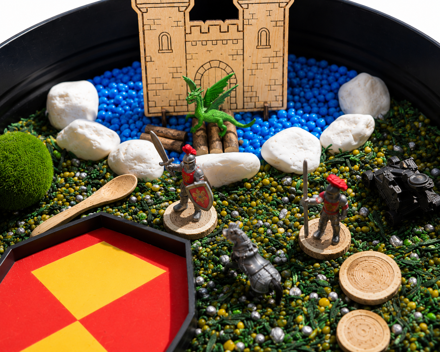 Medieval sensory play kit with dragons, knights and wooden castle.