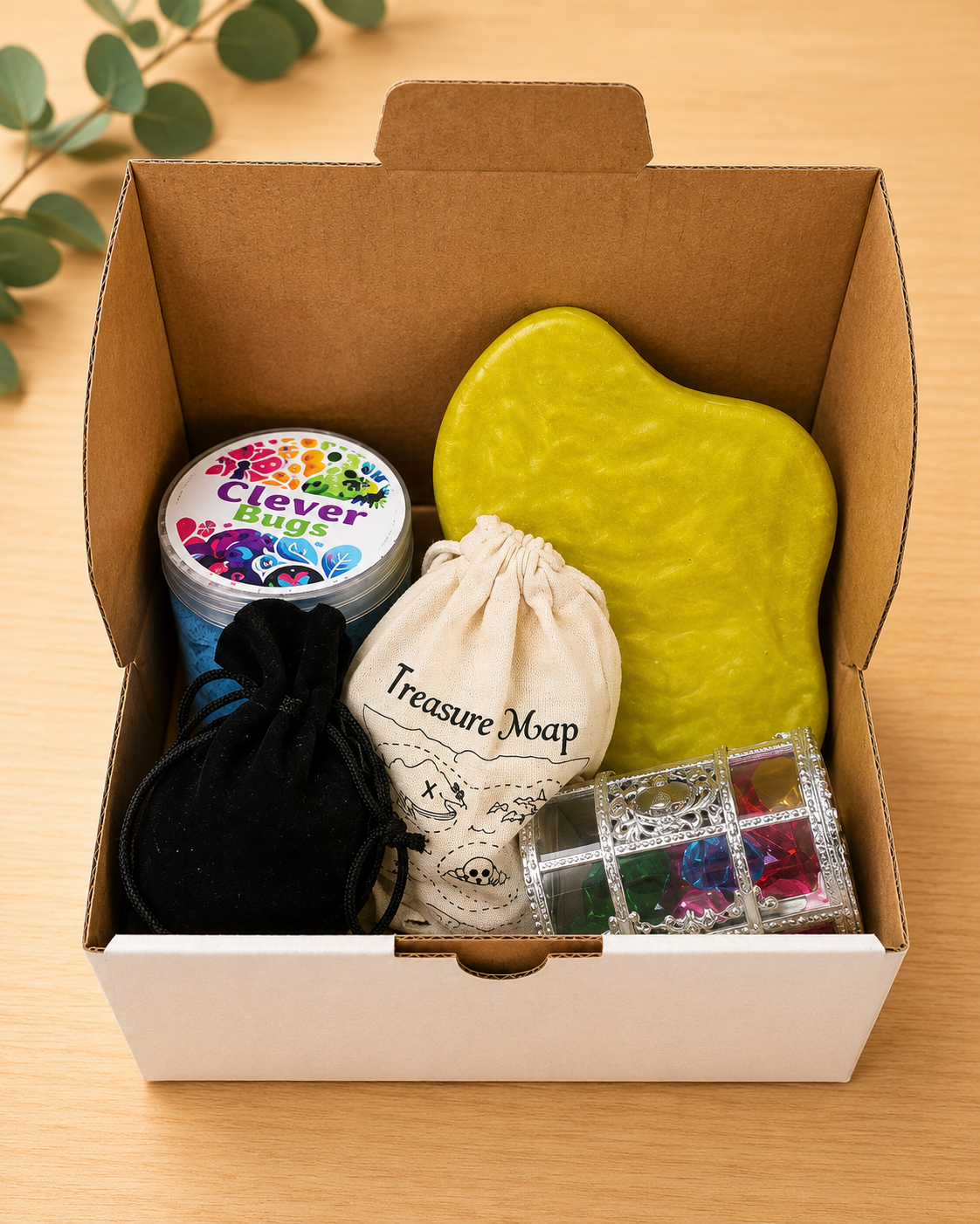 Pirate treasure sensory play with magic sand, coins, jewels and shells