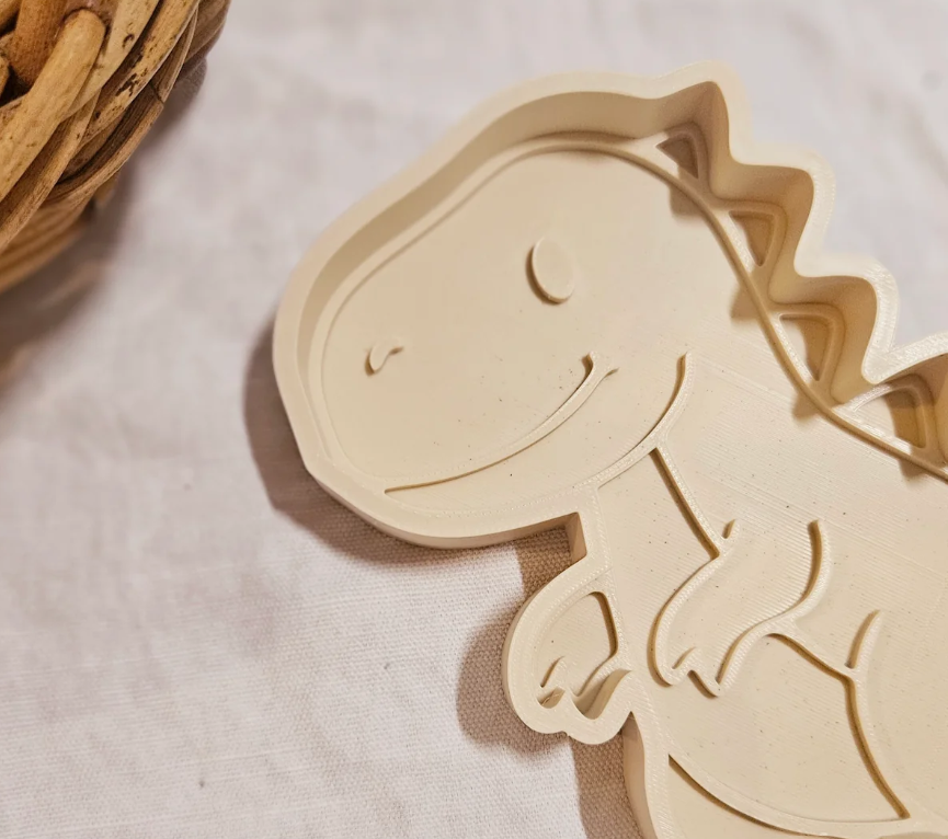 T-Rex sensory tray for dinosaur playdough activities
