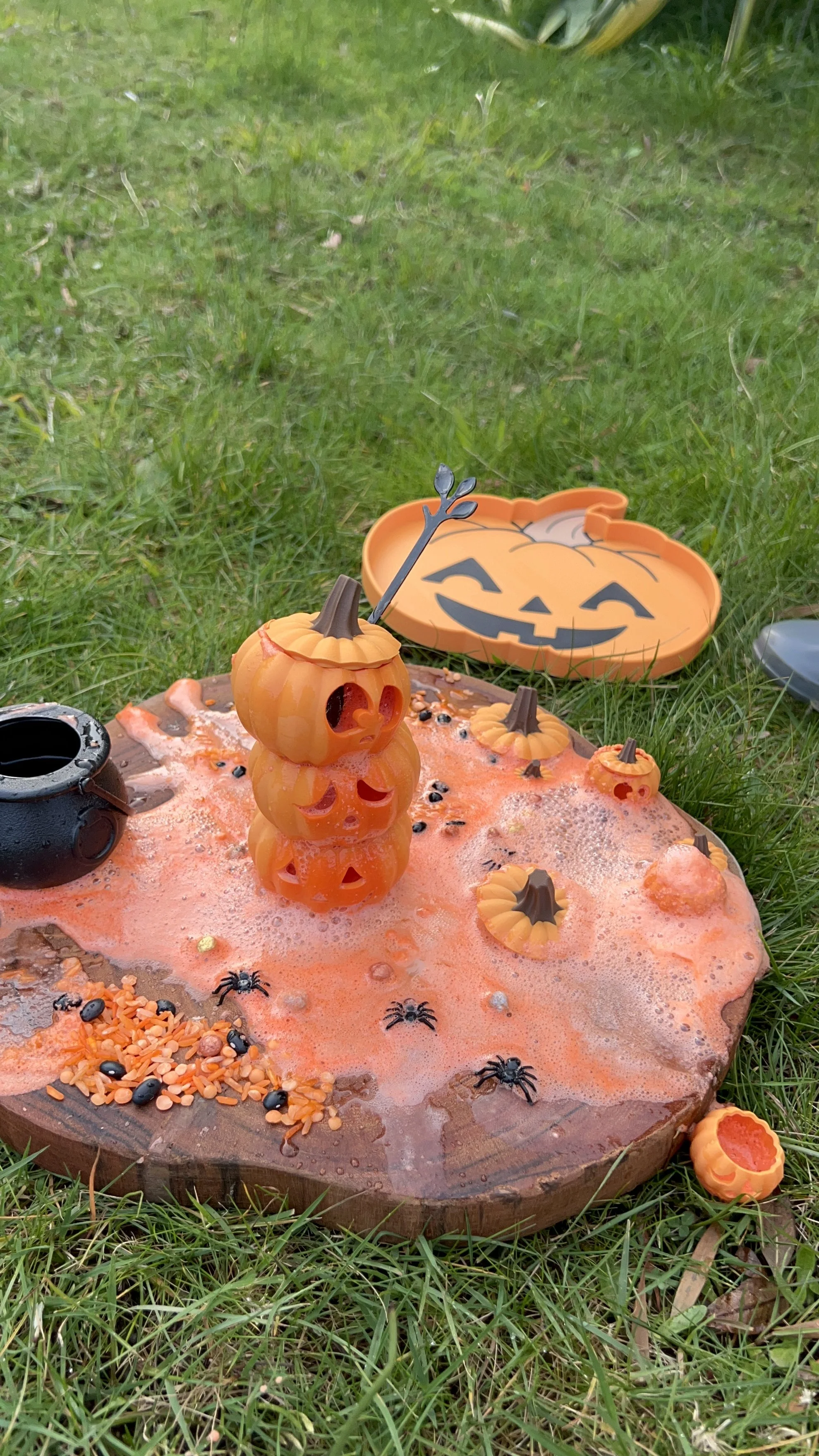 Spooky potion play invitation with Halloween ingredients, cauldron and sensory play accessories