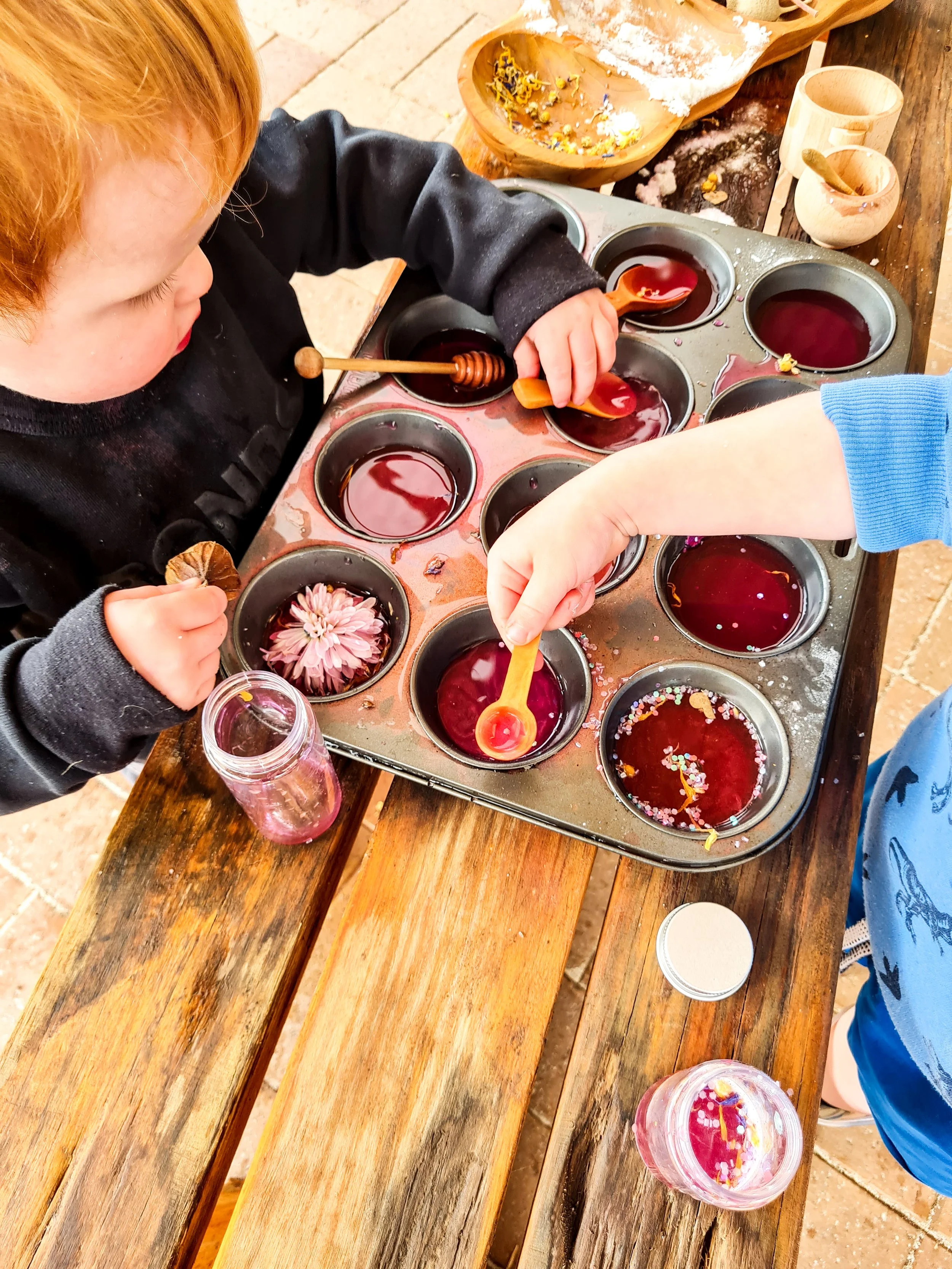 Australian-themed potion play setup for children with sensory ingredients, nature treasures and imaginative learning opportunities.
