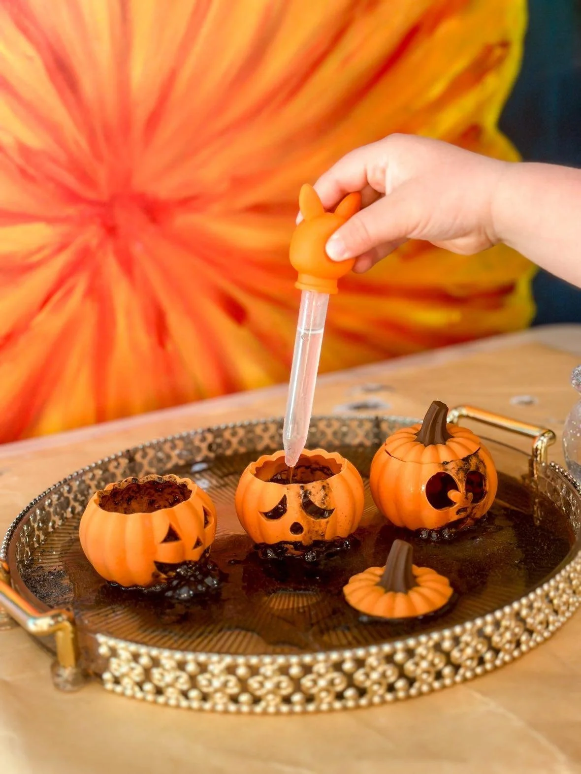 Spooky potion play invitation with Halloween ingredients, cauldron and sensory play accessories