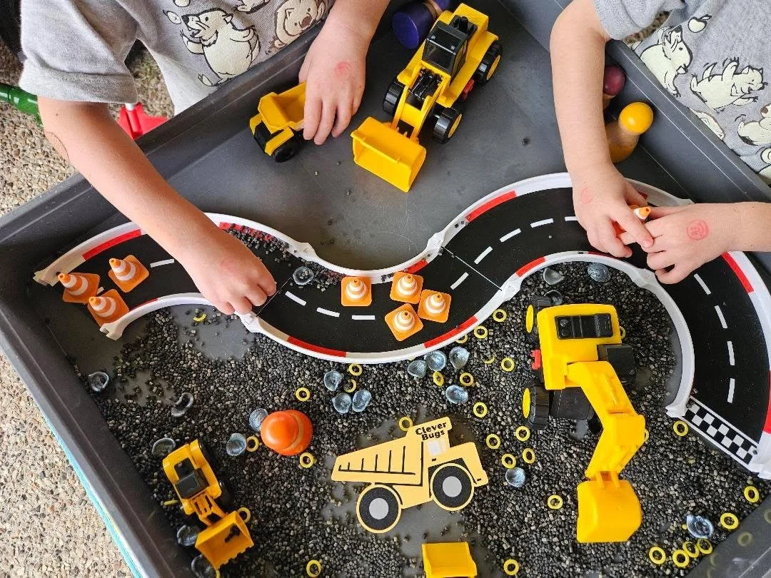 Mini traffic cones used in construction-themed sensory play and small world activities.