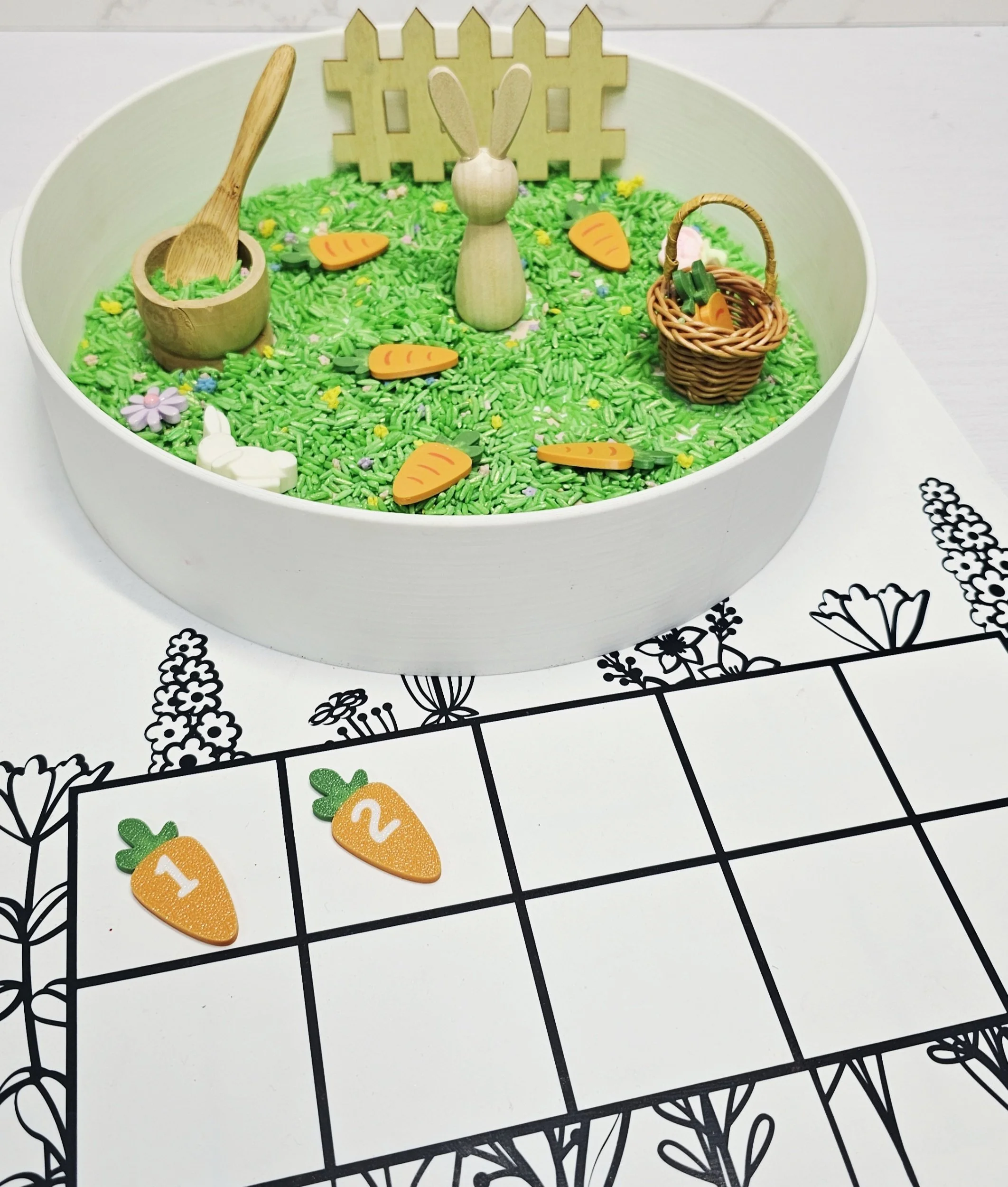 Easter sensory play activity with carrot math counters