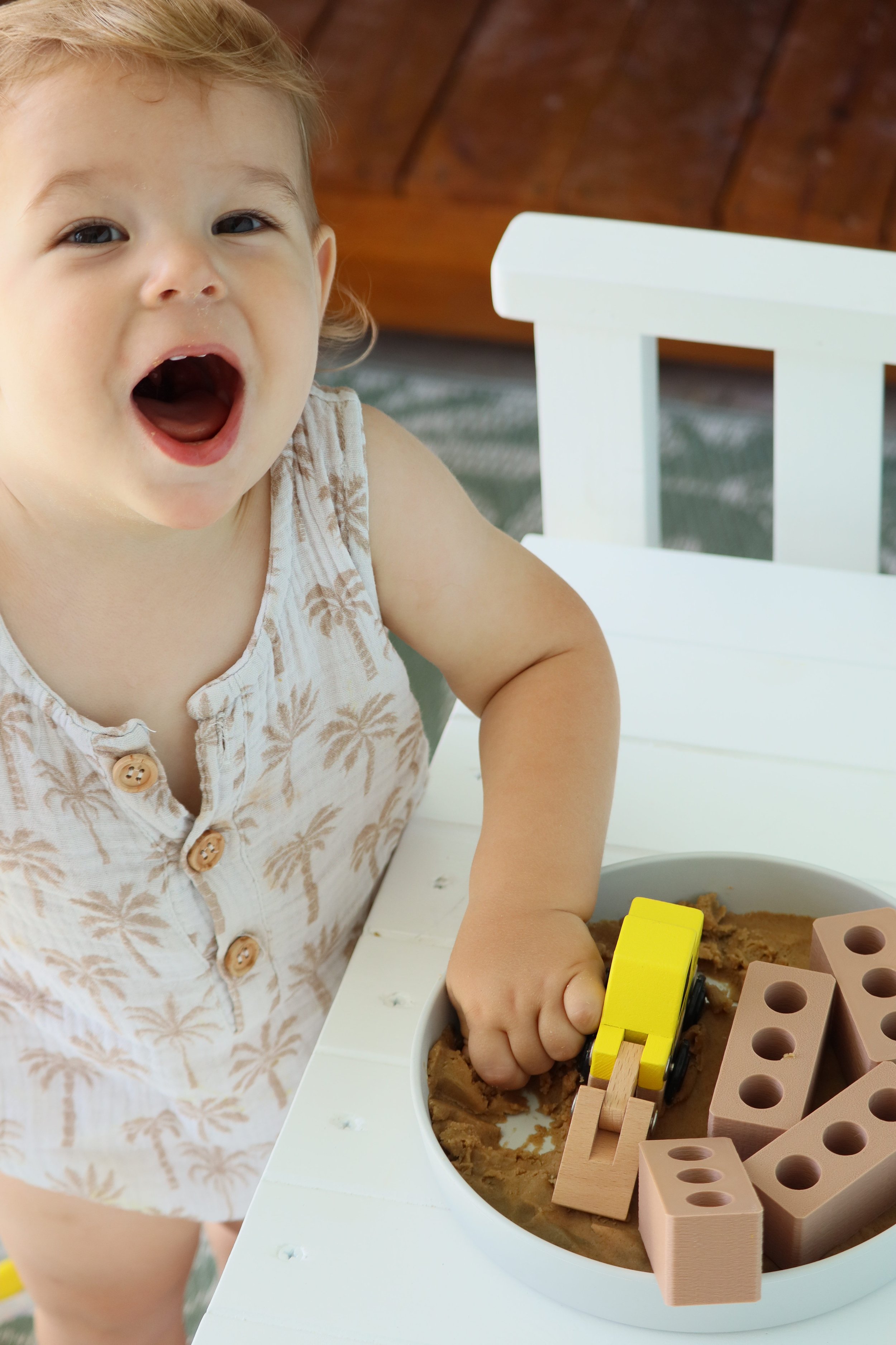 STEM-inspired construction play activity using mini bricks and sensory materials.