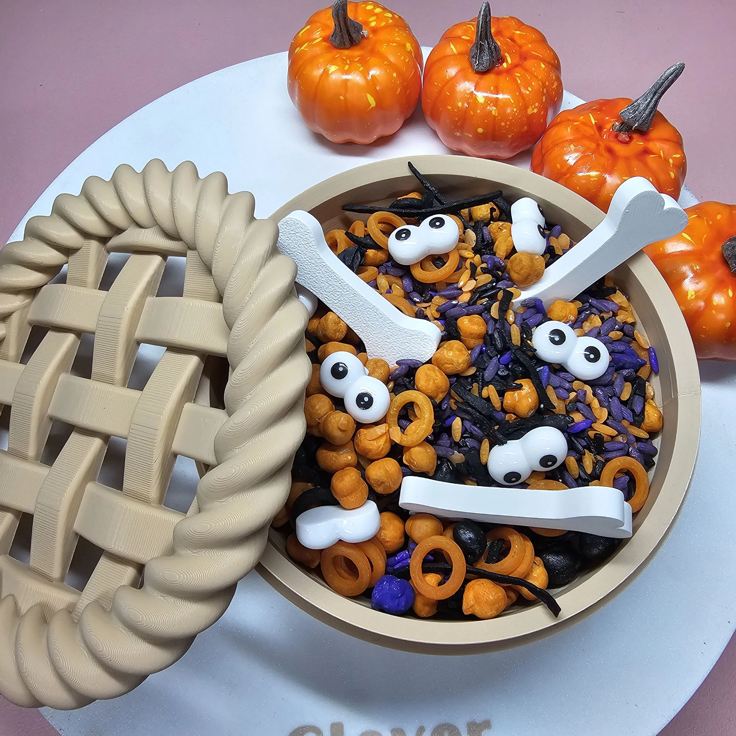 Halloween sensory play invitation featuring themed loose parts, scoops and sensory materials for open-ended exploration