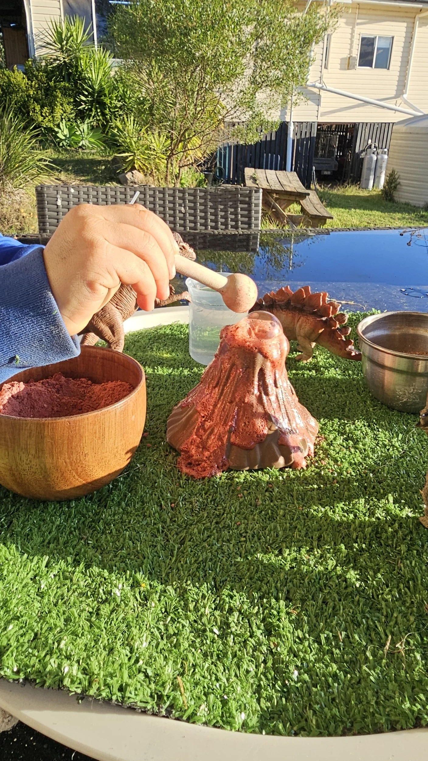 Volcano sensory play invitation with fizz reaction