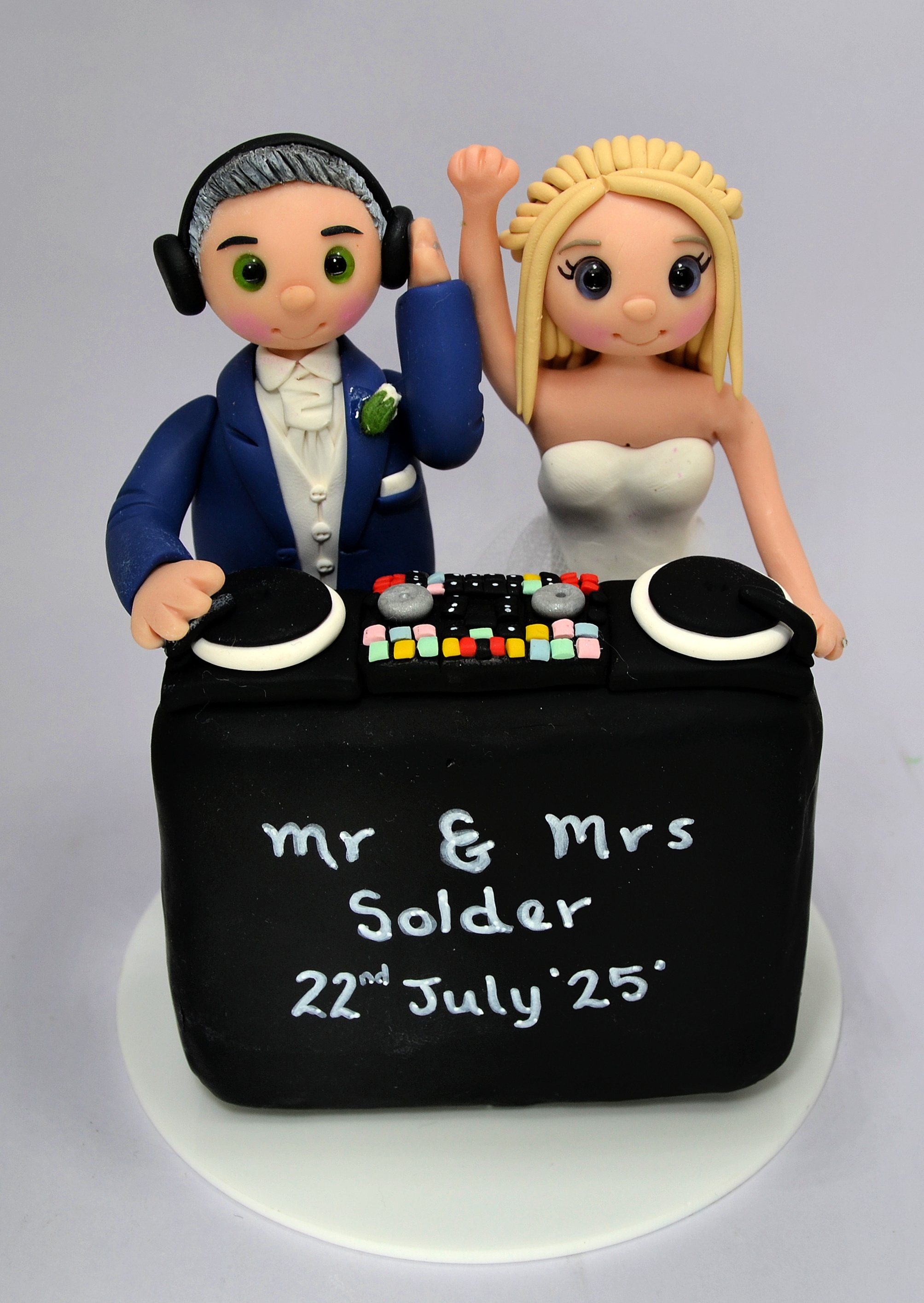 Handmade personalised wedding cake topper of a DJ bride and groom   by TinyLove wedding cake toppers UK