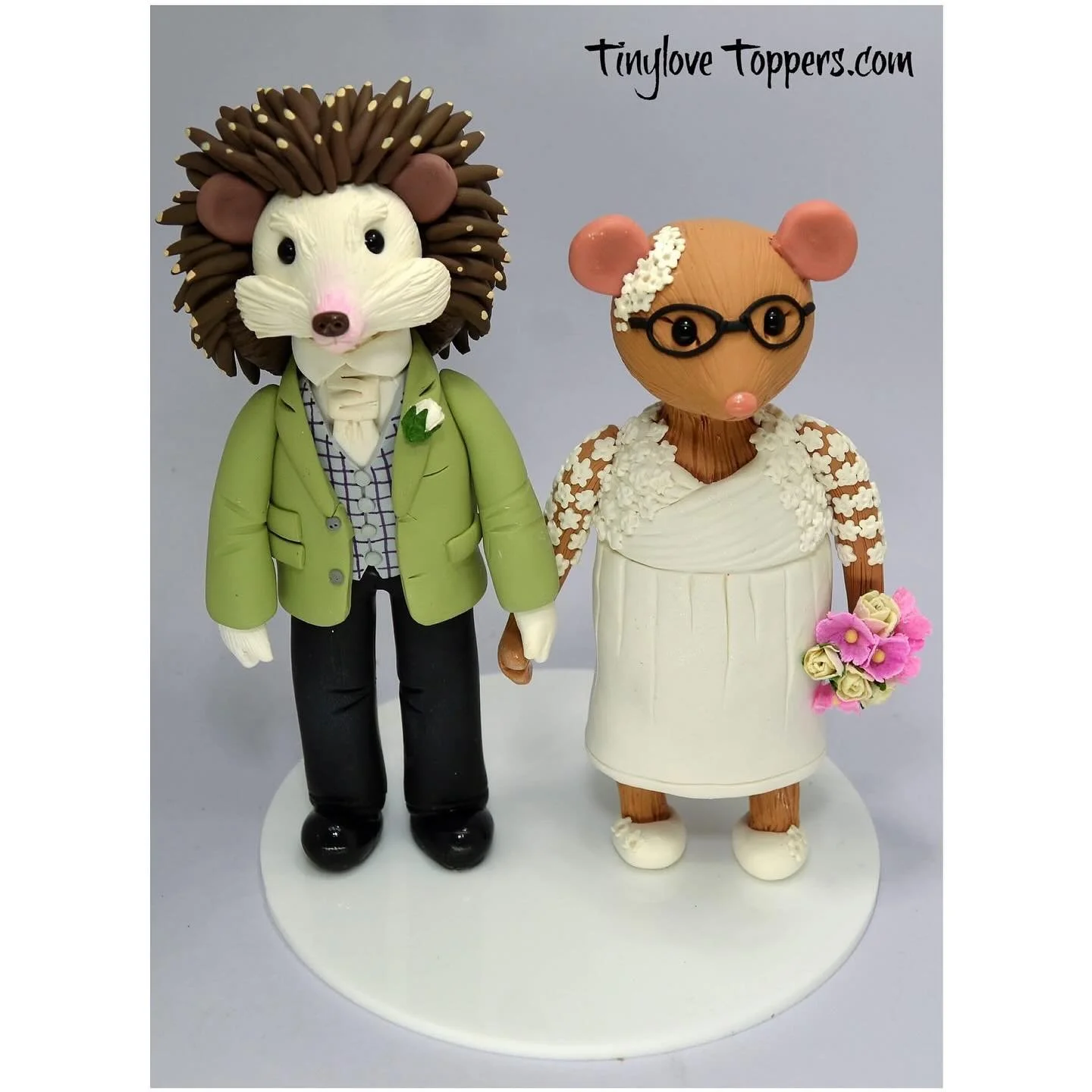 This is a wedding cake topper i made for a couple that didn't want a traditional style cake topper , they asked for a hedgehog groom and a mouse bride.

#customweddingcaketopper 
#weddingcaketopper