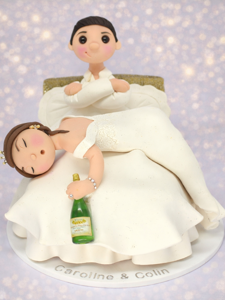 Wedding Cake Topper with Drunken Bride passed out in the bed