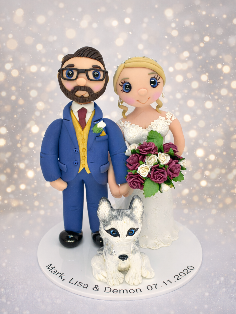 Personalised wedding cake topper figures standing together holding hands with Husky dog sat at their feet. 