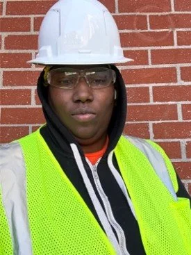 Brown skinned woman in hard hat