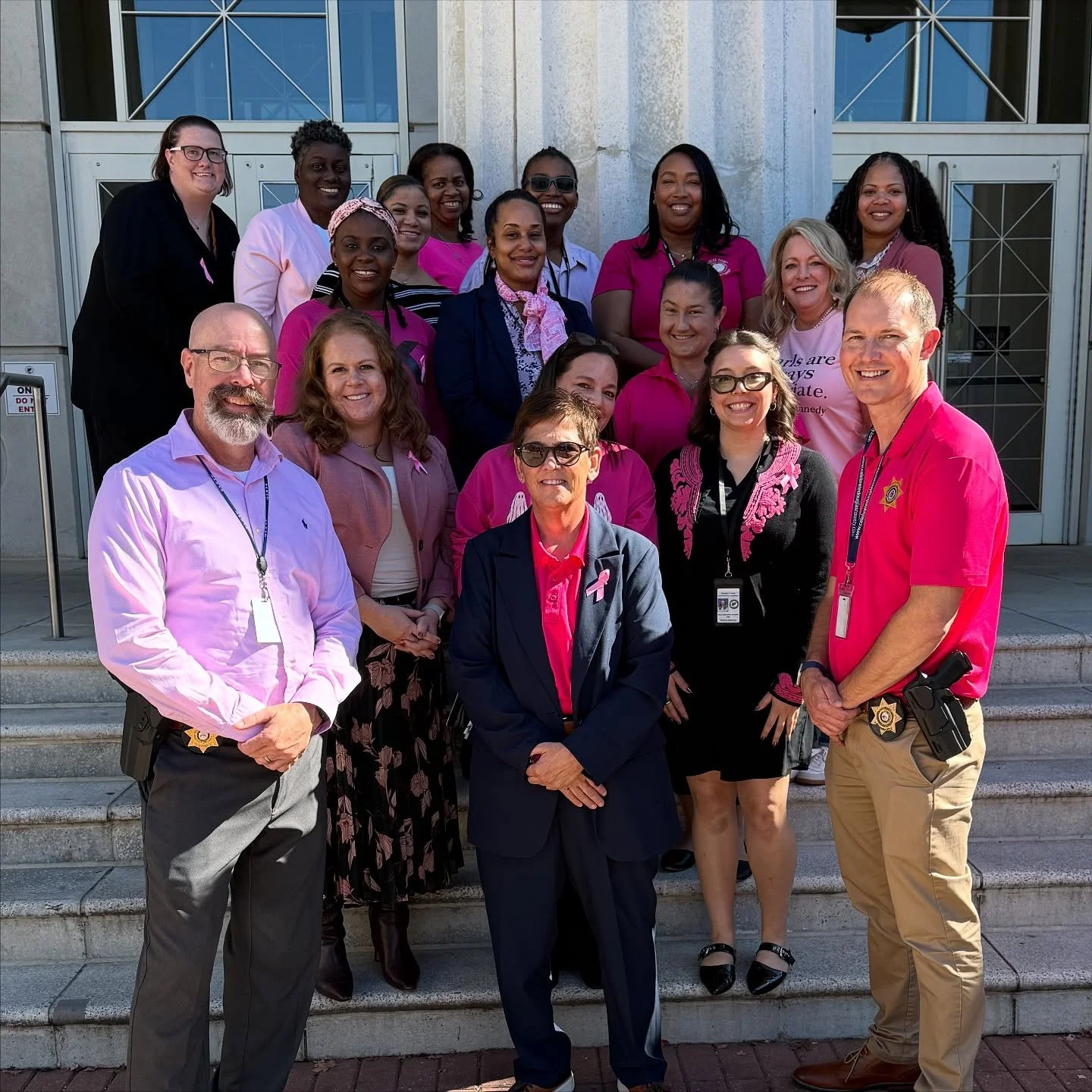 Yesterday, the Douglas County Courthouse was filled with pink as employees came together for the annual Pink Out in recognition of Breast Cancer Awareness Month.
Members of our office joined fellow county staff on the courthouse steps for a ceremony
