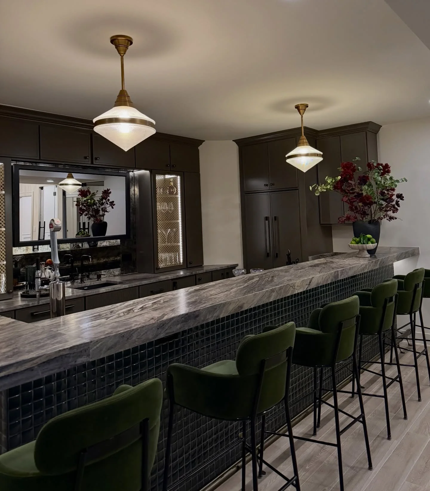 A green dream residential bar moment.
Modern lines, warm wood tones, and moody lighting&mdash;designed to feel like an intimate lounge right at home. This is the kind of custom home bar design that elevates everyday hosting (and makes weeknights feel