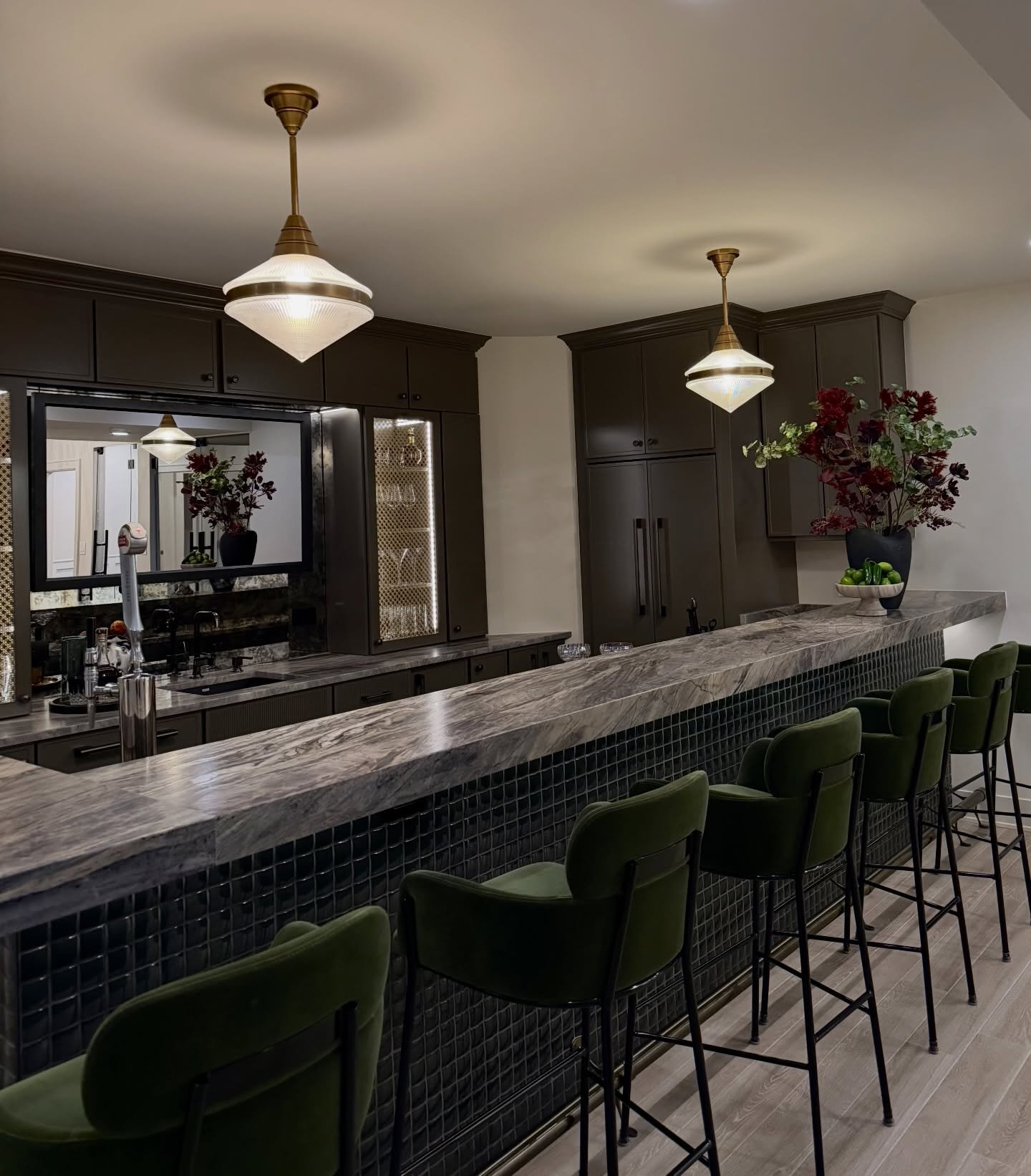 A green dream residential bar moment.
Modern lines, warm wood tones, and moody lighting&mdash;designed to feel like an intimate lounge right at home. This is the kind of custom home bar design that elevates everyday hosting (and makes weeknights feel