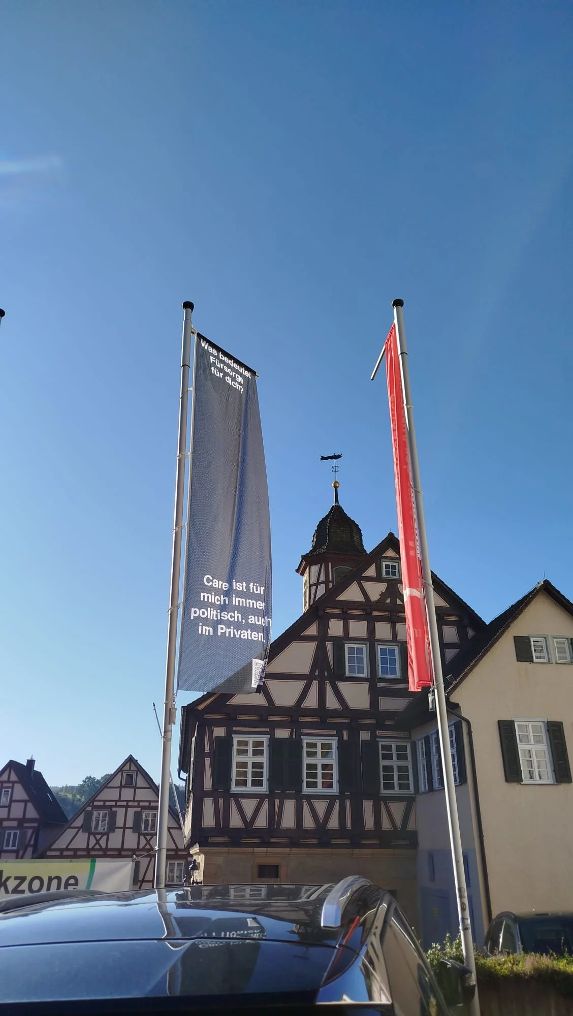 image description: installation of German iteration of Perspective at Festival der KulturRegion “JETZT!” in Germany, featuring a flag version of the project.