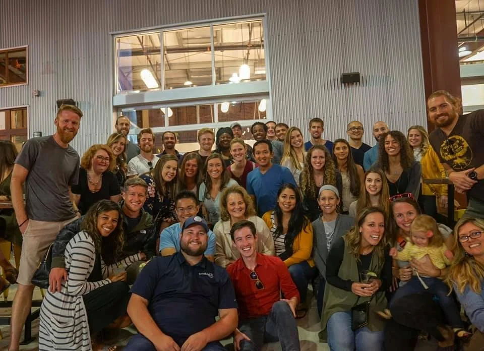 A group of travel therapists smile for the camera at a travel therapist meet-up. New friends/connections is one of the biggest reasons to become a travel physical therapist.