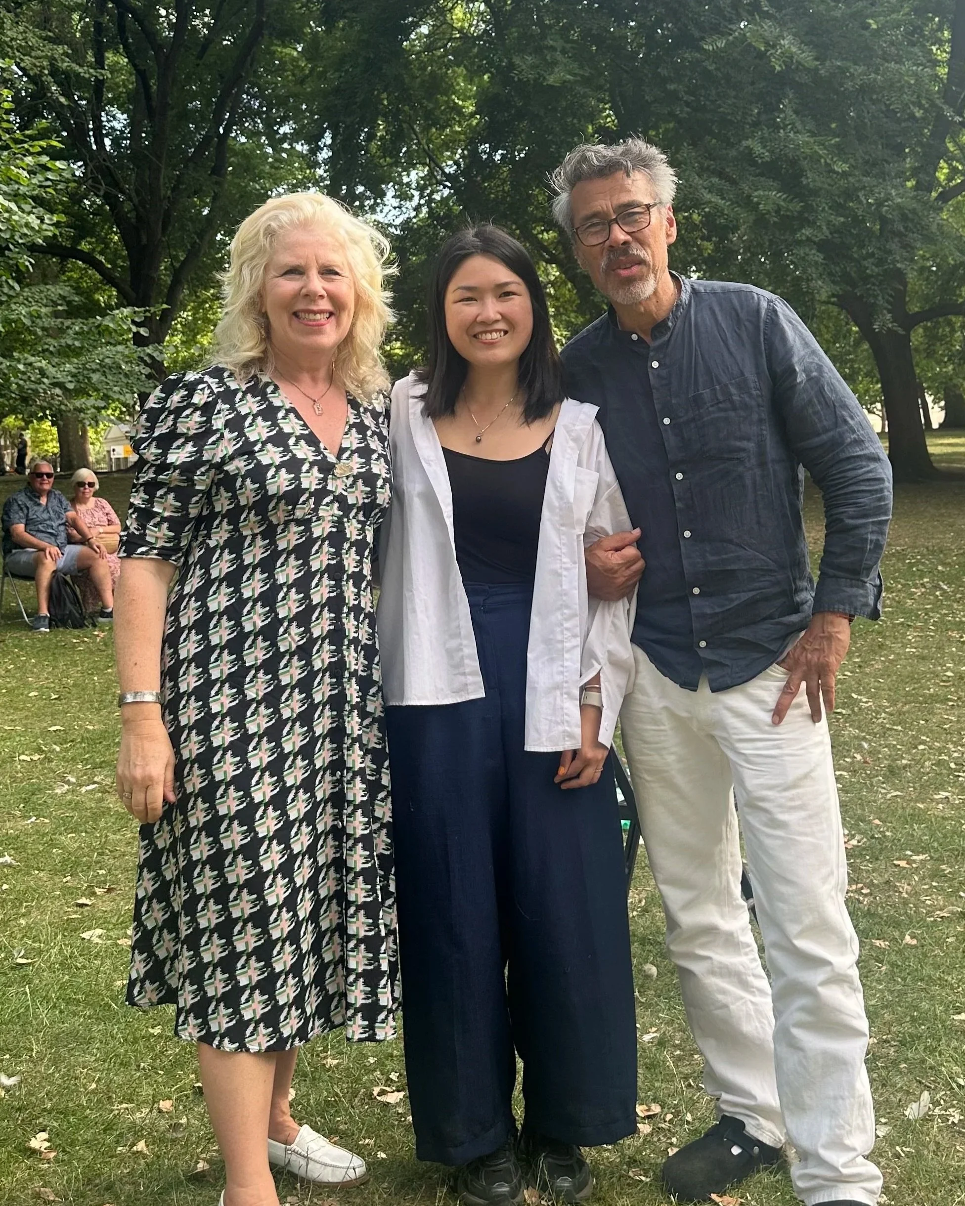 Alice Kwan posing with Landscape Artist of the Year judges Kathleen Soriano and Tai Shan Schierenberg during the filming of Series 11.