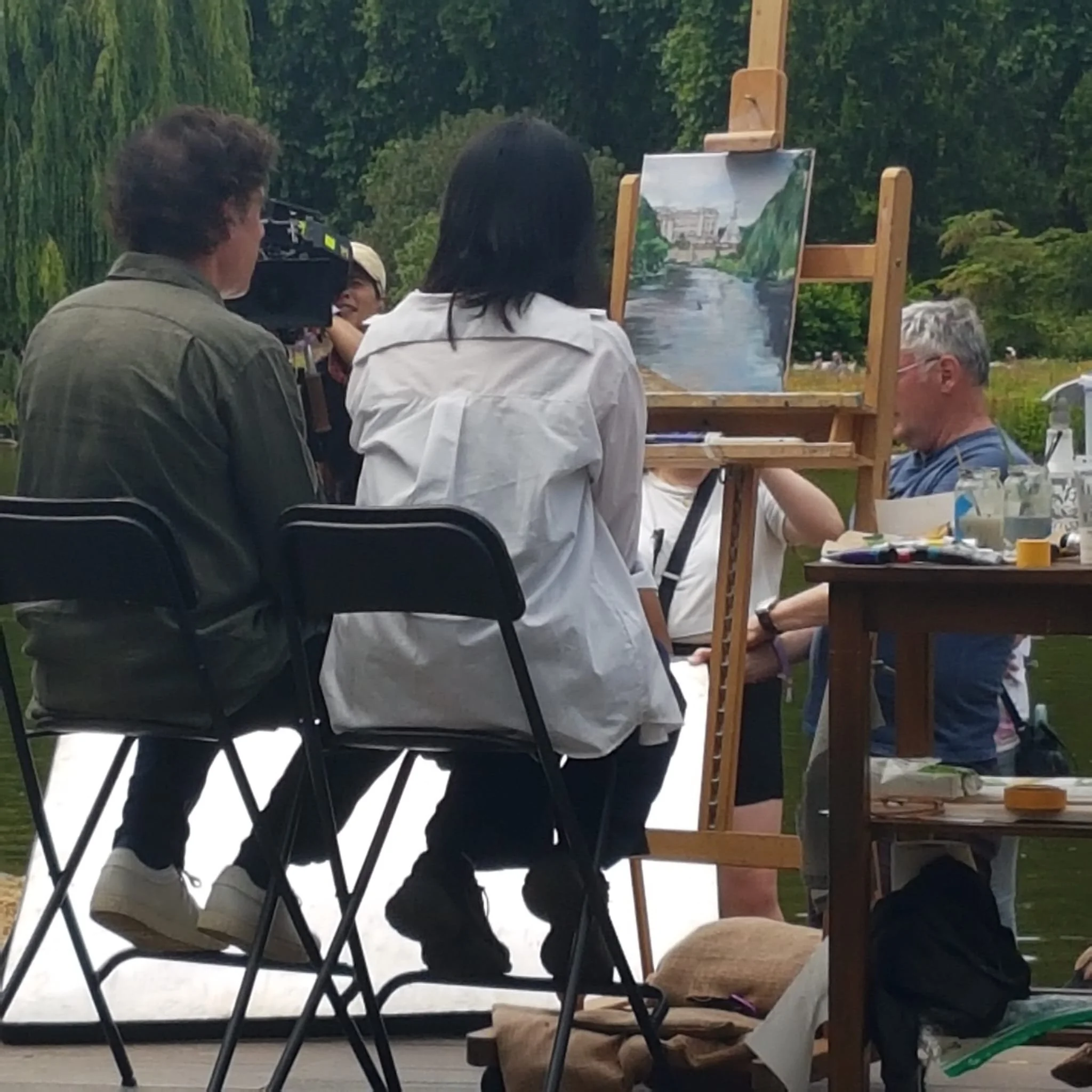 Host Stephen Mangan talking to artist Alice Kwan about her painting progress during the filming of Landscape Artist of the Year.