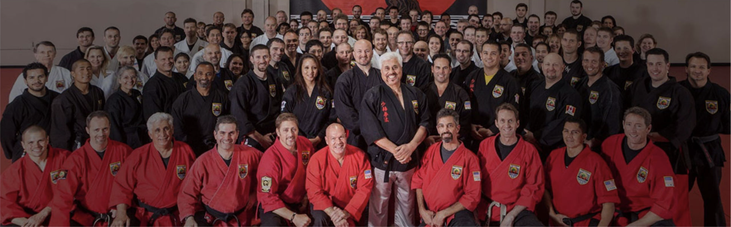 A large group picture of all ranks of USSD instructors smiling at the camera