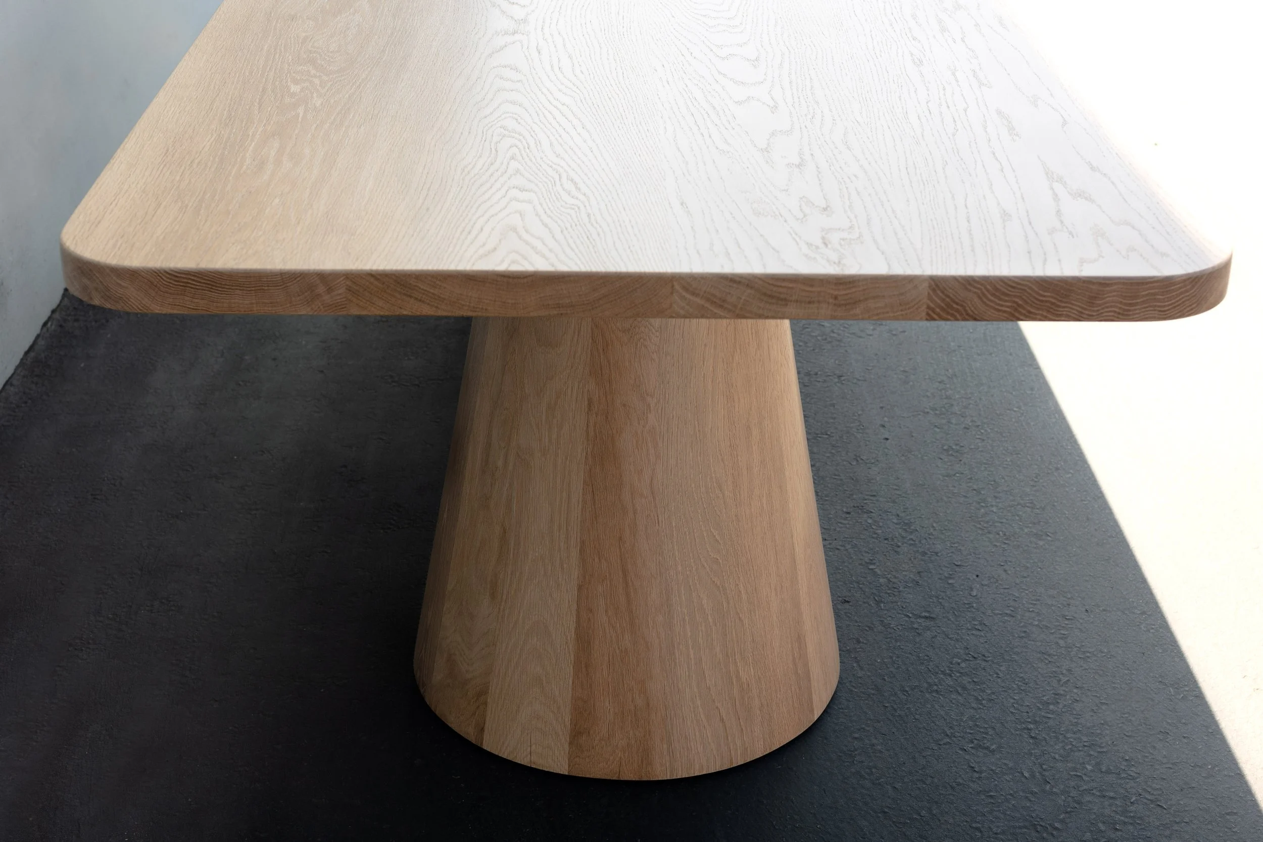 White oak cone base dining table
