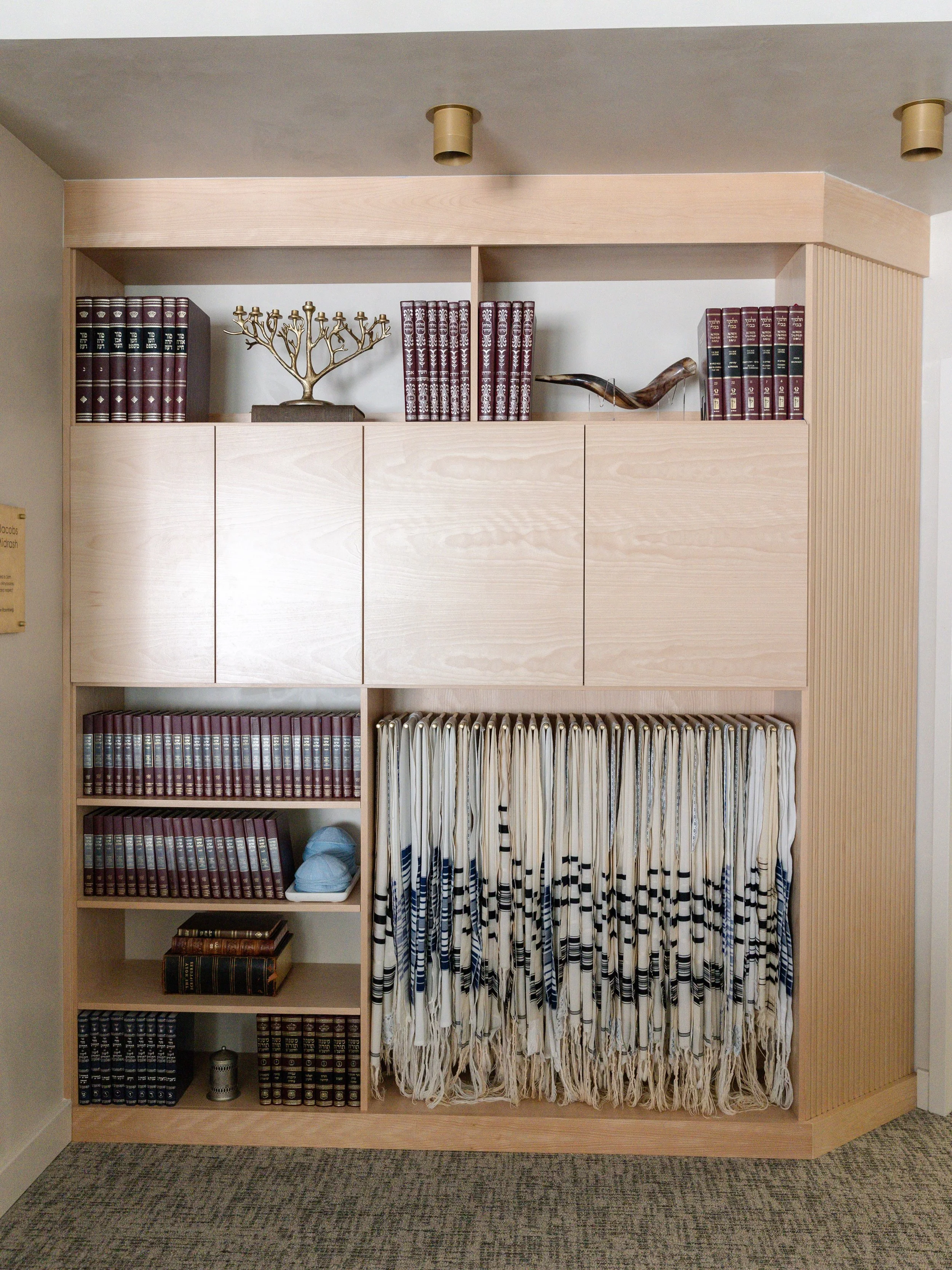 We&rsquo;re excited to share some more details from the Synagogue build. 

This custom built-in bookshelf was made to fit against the wall when entering the room. The angled fluted panel was added to help funnel people entering the room. 

Made entir