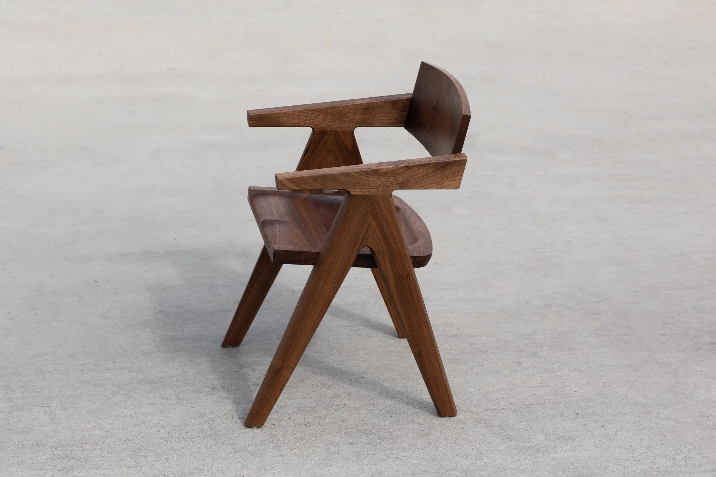 Sculptural dining chair in walnut