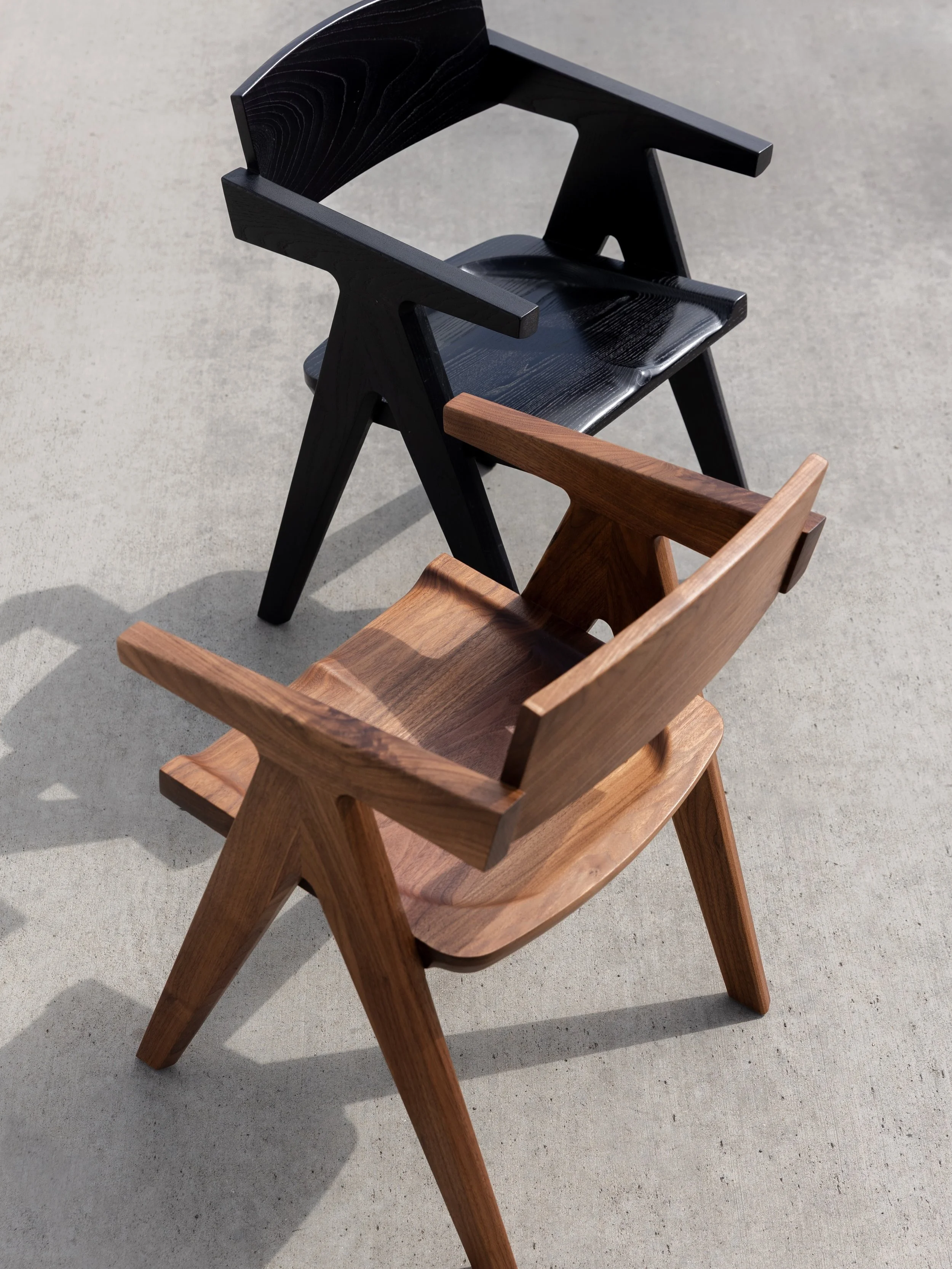 Our &lsquo;Zodiac&rsquo; chairs shown in both blackened ash and solid superior grade walnut.

We revised Zodiac until it was perfectly dialed in. The carved seat, arm height, seat angle, and curved back rest all ensure maximum comfort.

We experiment