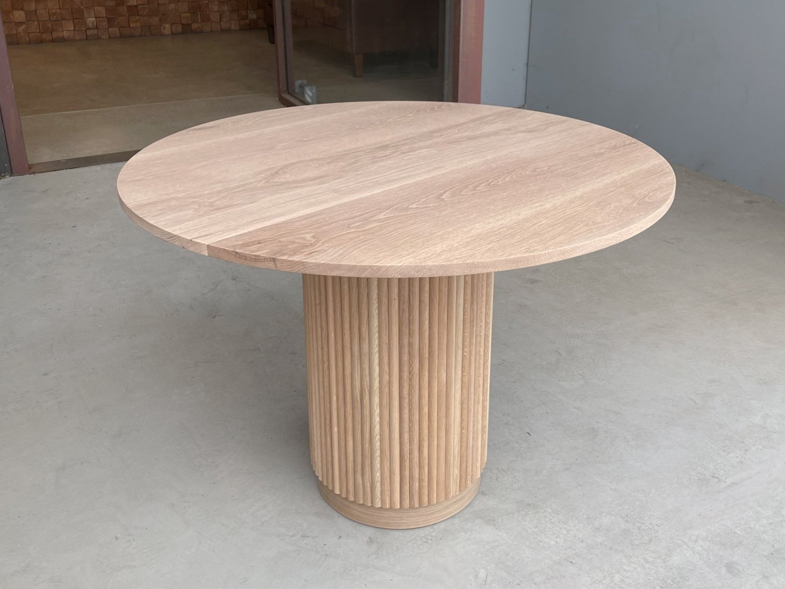 Fluted pedestal entry table in solid white oak
