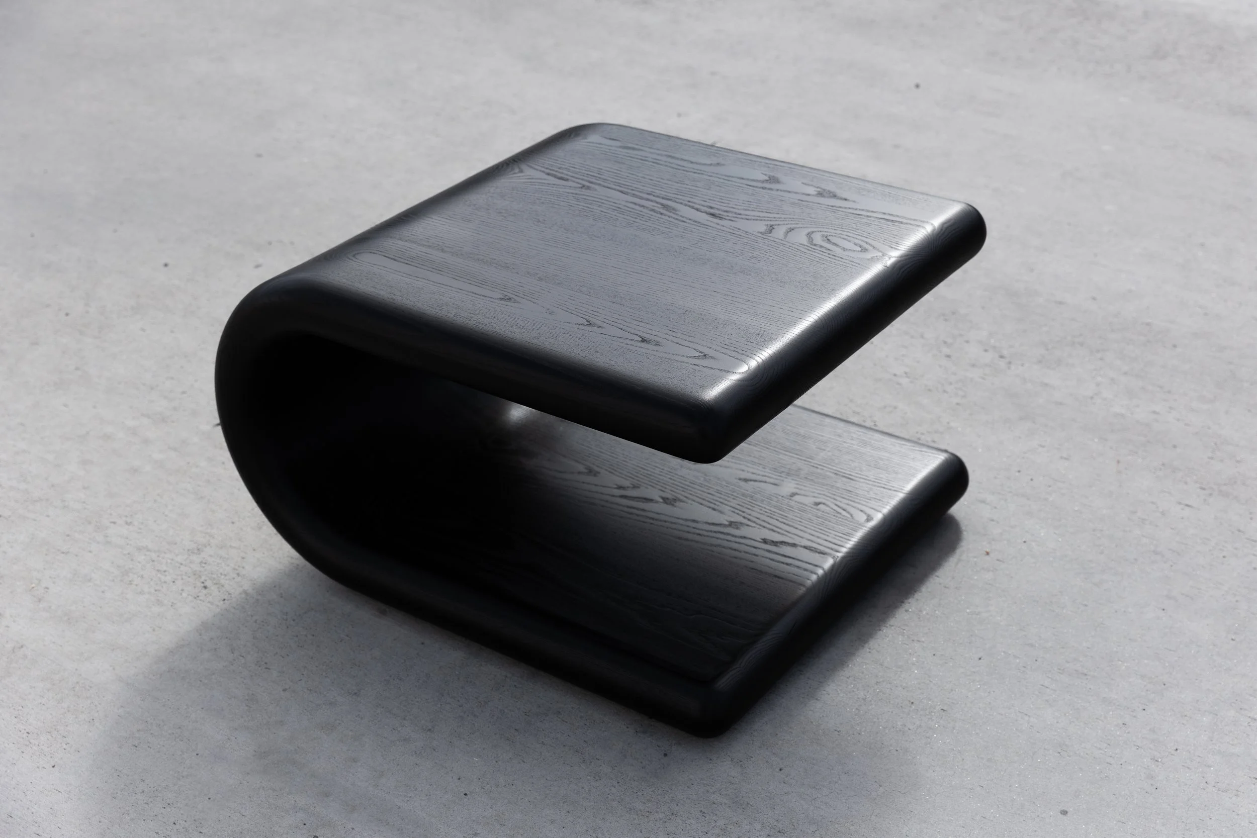 Curved silhouette sculptural coffee table